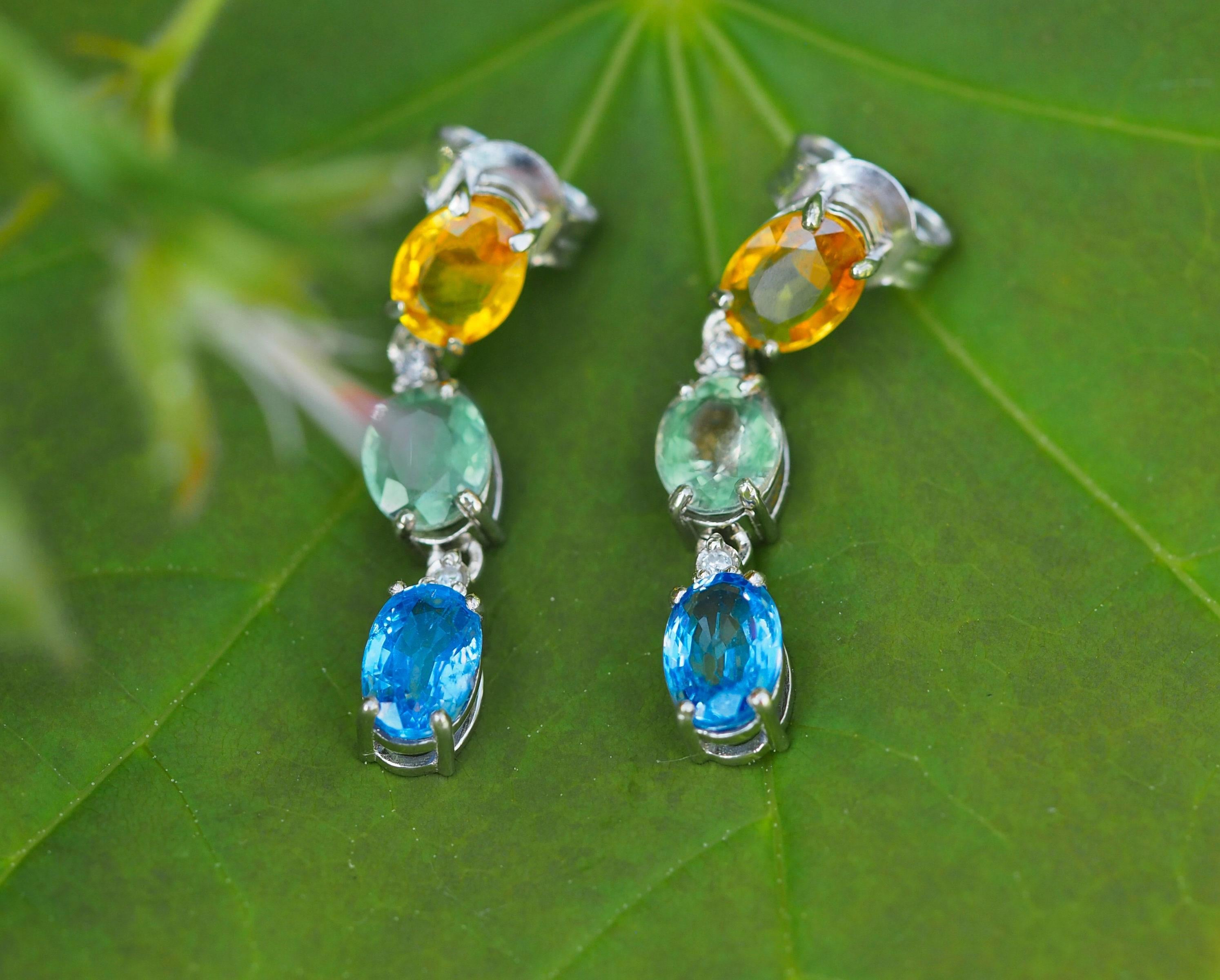 Blue, yellow and green oval sapphire earrings. Sapphire gold earrings. Sapphire statement earrings. Tricolor earrings. 

Metal type: 14kt gold
Weight: 2.80 g.
Size: 23 x 4.5 mm.

Set with sapphires - 6 pieces, color - blue light, green, yellow.
Oval