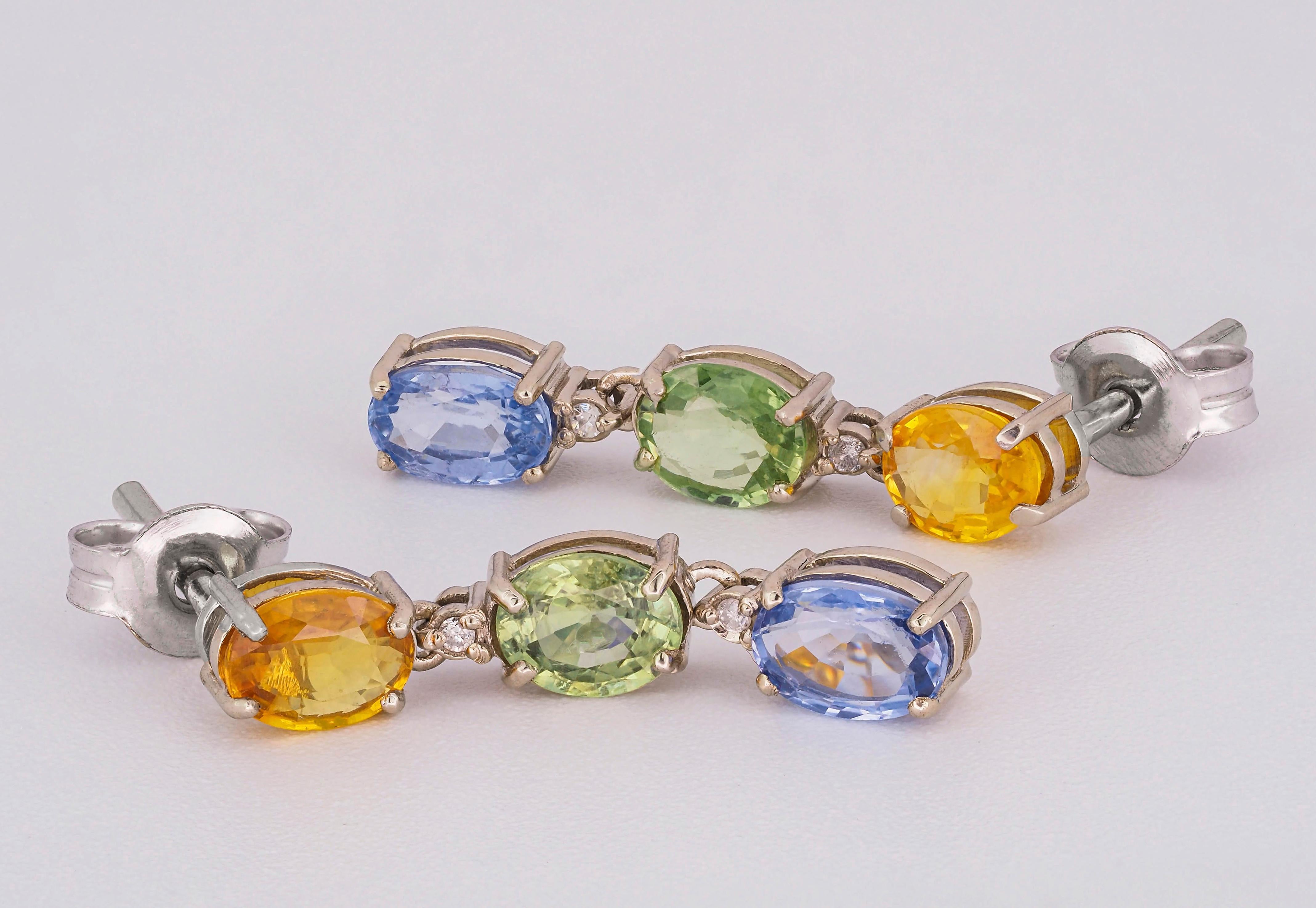 Oval Cut Blue, yellow green sapphire 14k gold earrings. For Sale