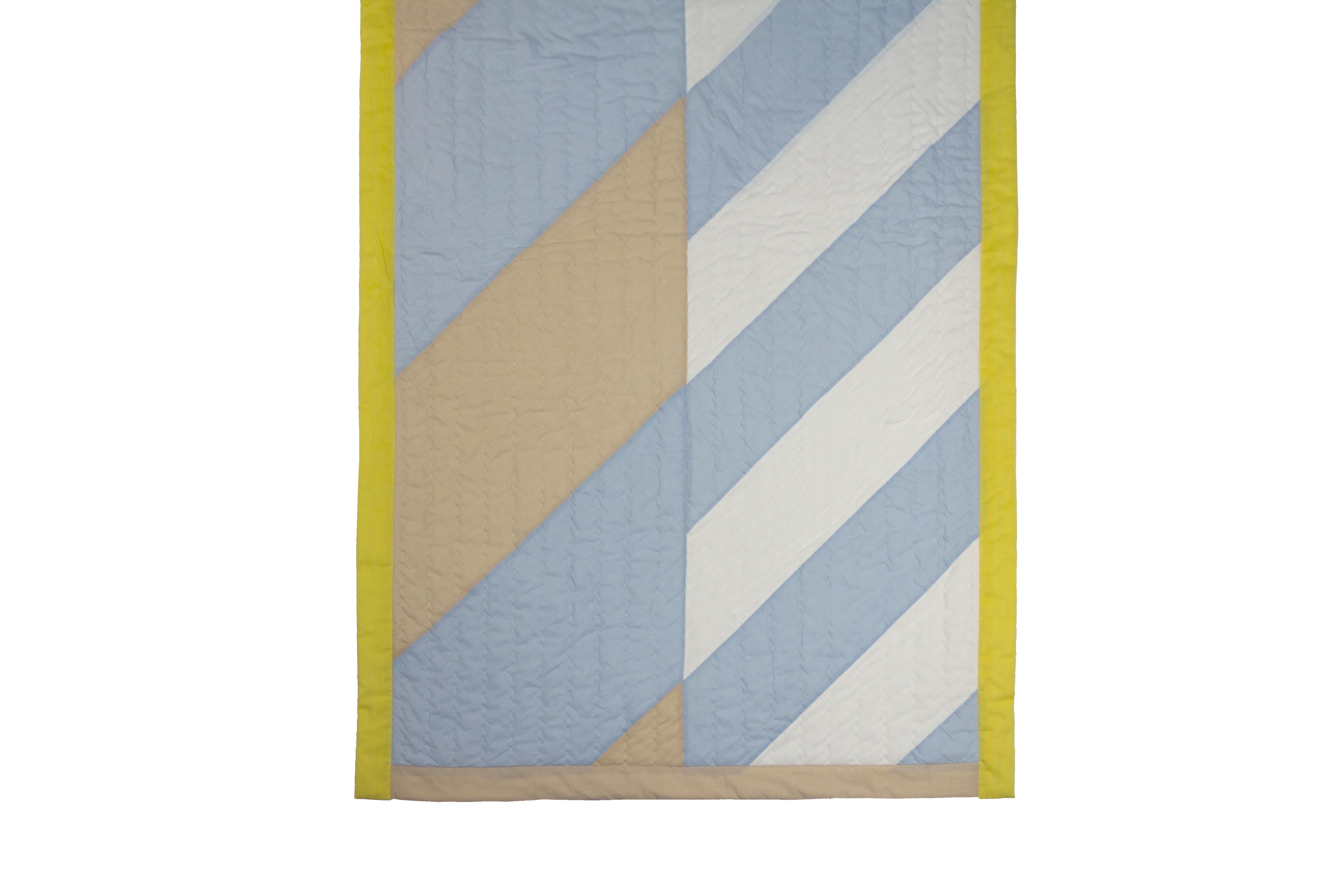 'Small diagonal' handmade quilt

100% Organic cotton quilts hand made in short runs by a small family run artisan studio in India. Made using GOTS certified fabric which is screen printed using AZO free water based non toxic inks. Hand made by