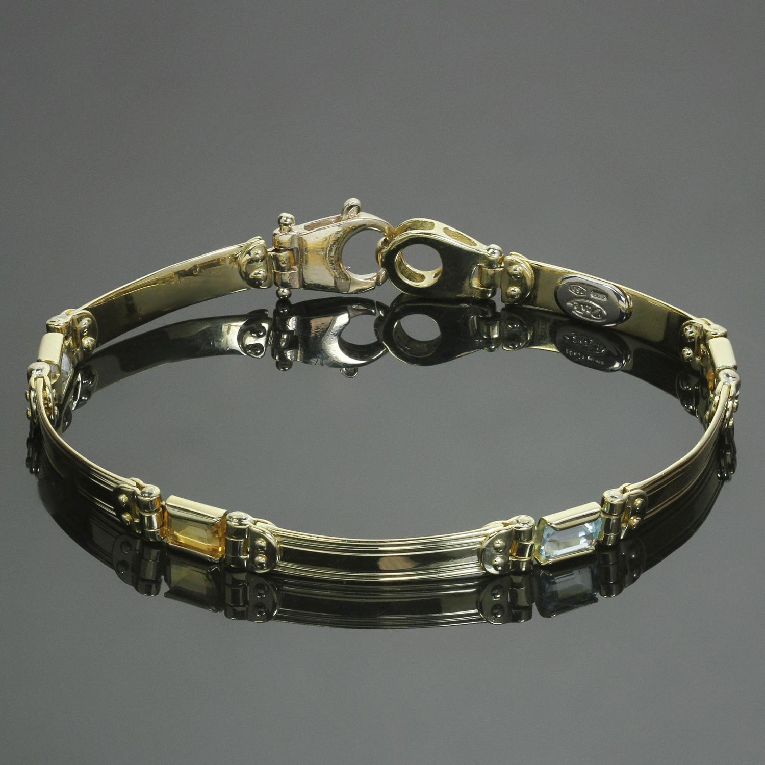 This classic estate bracelet is crafted in 18k yellow gold and features a chic link design accented with links of rectangular-cut blue and yellow topaz gemstones. Made in Italy circa 1980s. Measurements: 0.19