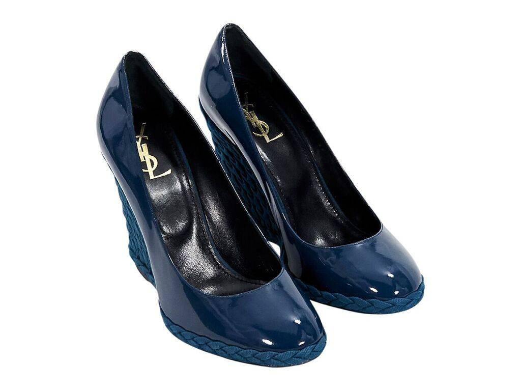 Product details:  Blue patent leather Majorelle wedges by Yves Saint Laurent.  Round toe.  Braided trim.  Label size EU 39.  4.5