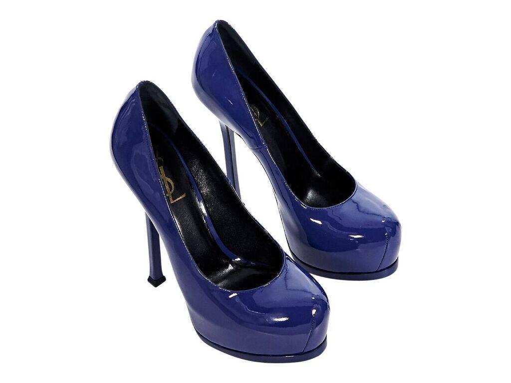 Product details:  Blue patent leather Tribute pumps by Yves Saint Laurent.  Towering stiletto and platform design.  Round toe.  Slip-on style.  Size EU 37.  5.5
