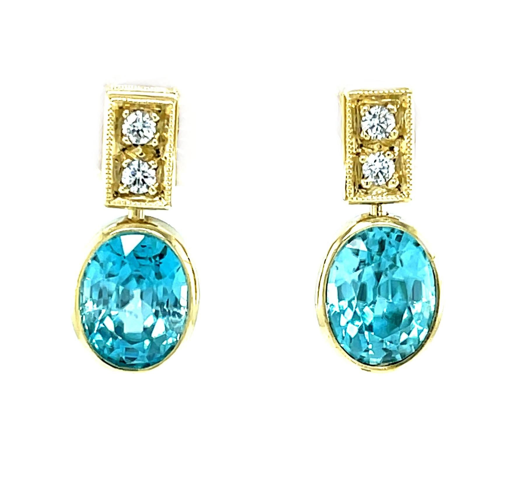 These gorgeous blue zircon and diamond earrings feature a stunning pair of beautifully matched, vibrant blue zircons that have a combined weight of 9.38 carats. Blue zircons are known for spectacular brilliance and this pair of lovely ovals has been