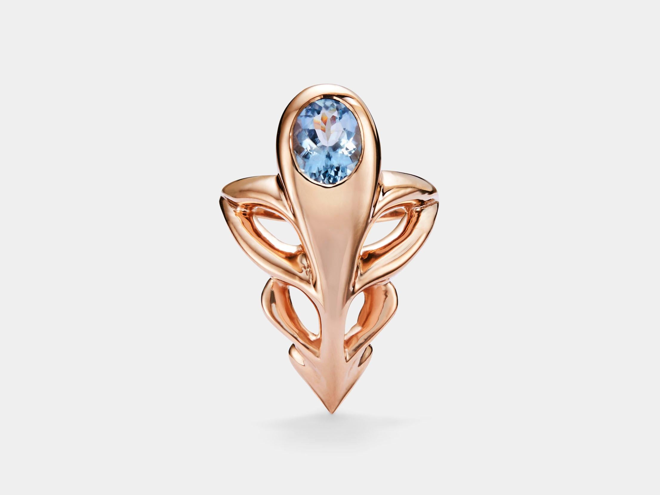 The Caduceus Ring with Blue Zircon from modern fine jewelry house, Baker & Black. A cocktail ring featuring an elongated openwork design that sits nice and low on the finger.

• blue zircon 
• measure 28mm (1 ⅛