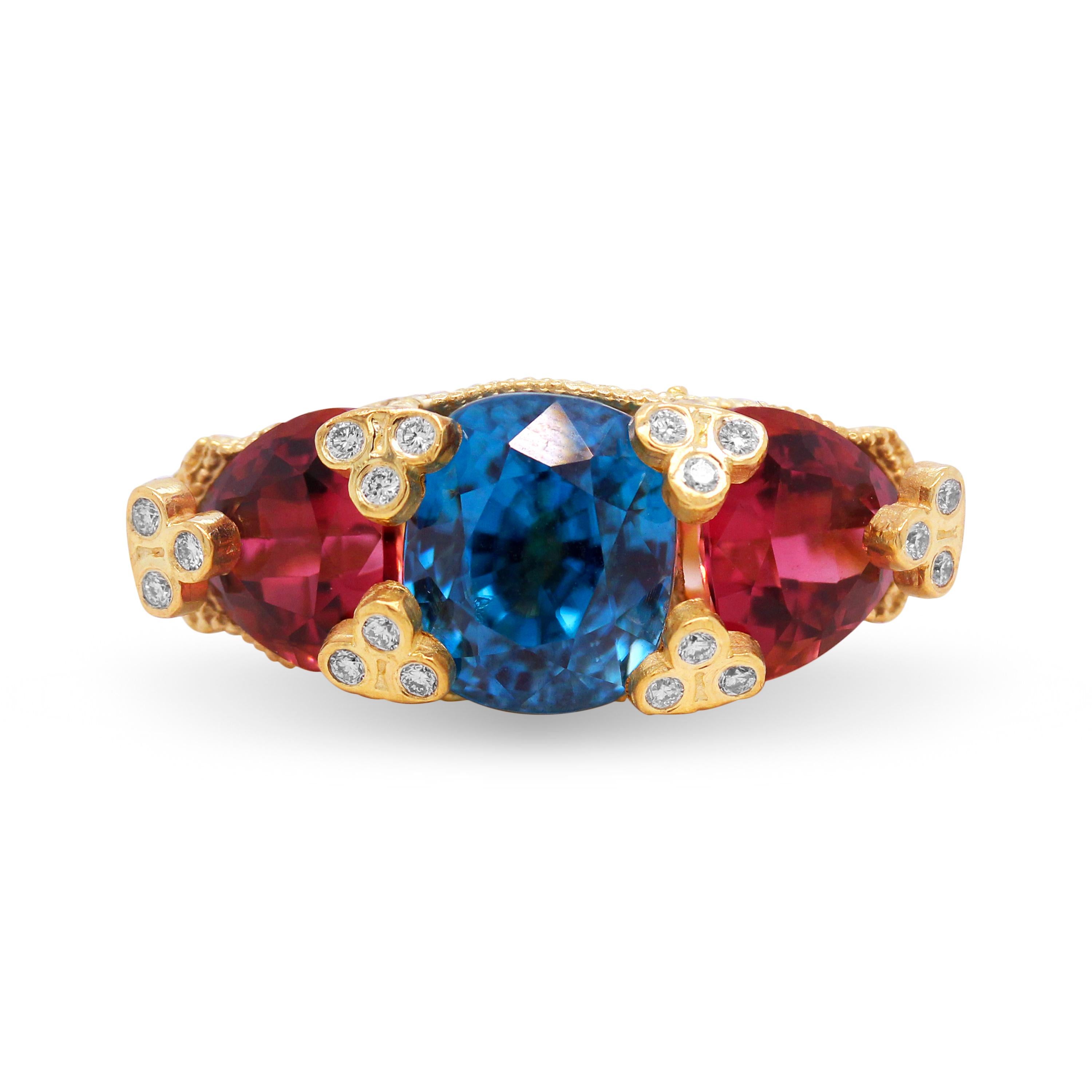 18K Yellow Gold and Diamond Three-Stone Ring with Blue Zircon center and Trillion Rubellites by Stambolian

This state-of-the-art ring by Stambolian is a one-of-a-kind

One cushion cut, Blue Zircon is set in the center with two, trillion-cut