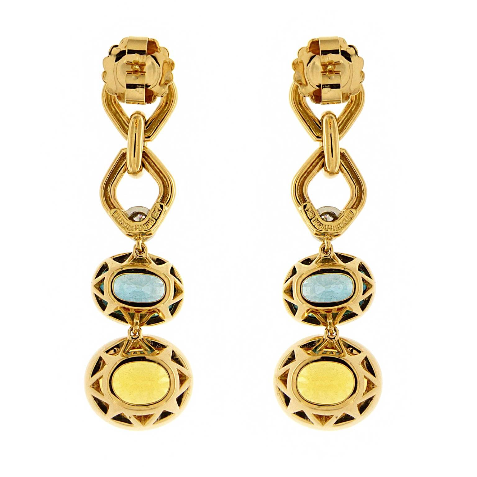 These lovely earrings feature Blue Zircon and Yellow Beryl with Round Brilliant cut Diamonds in 18kt Yellow Gold. Diamond weight 0.57 cts.