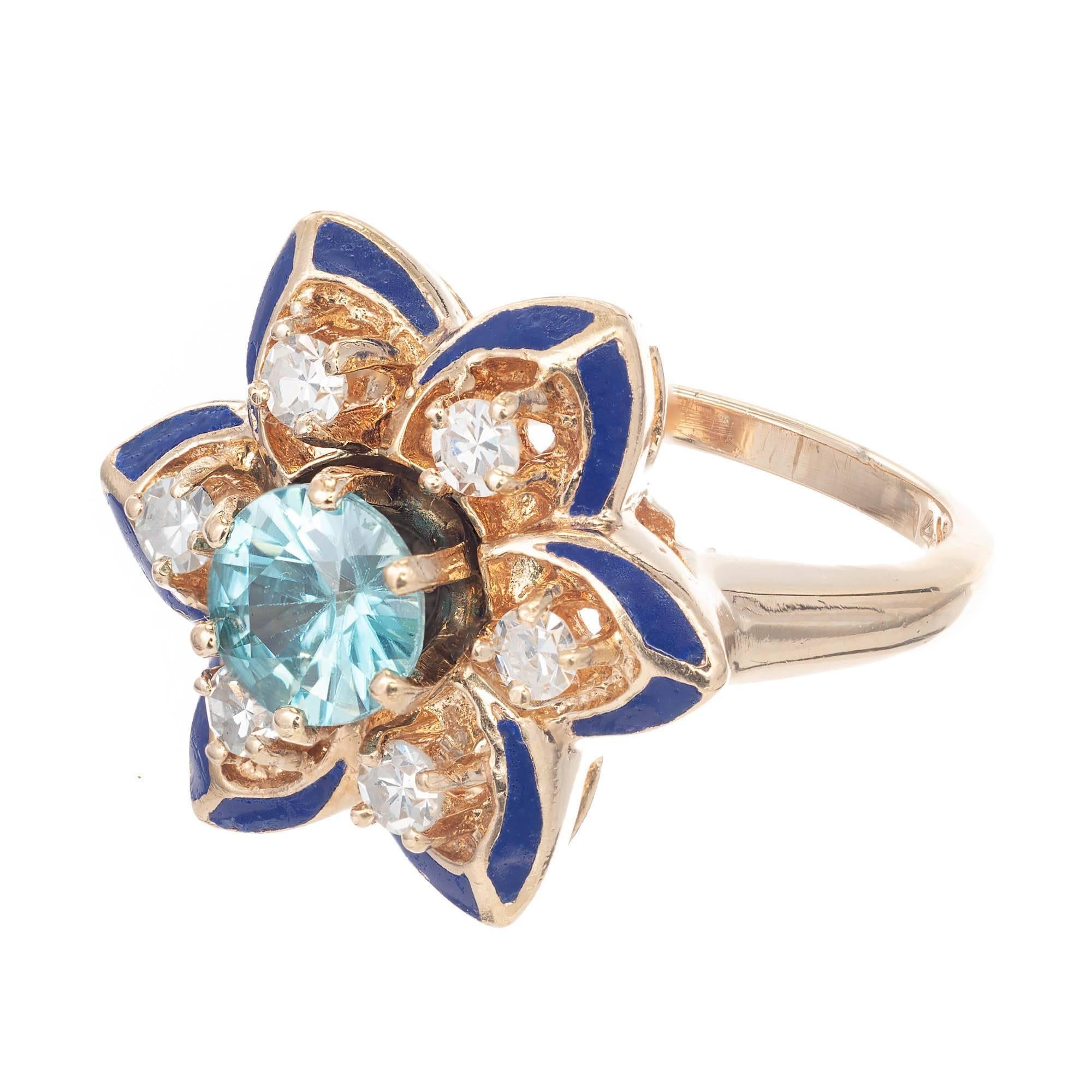 1950s Blue Zircon Diamond Black Enamel Yellow Gold Flower Cocktail Ring. Flower design setting with black enamel, diamonds and a round cneter  blue Zircon.

One 5.8mm genuine blue Zircon, approx. total weight .95cts, VS
6 full cut diamonds, approx.