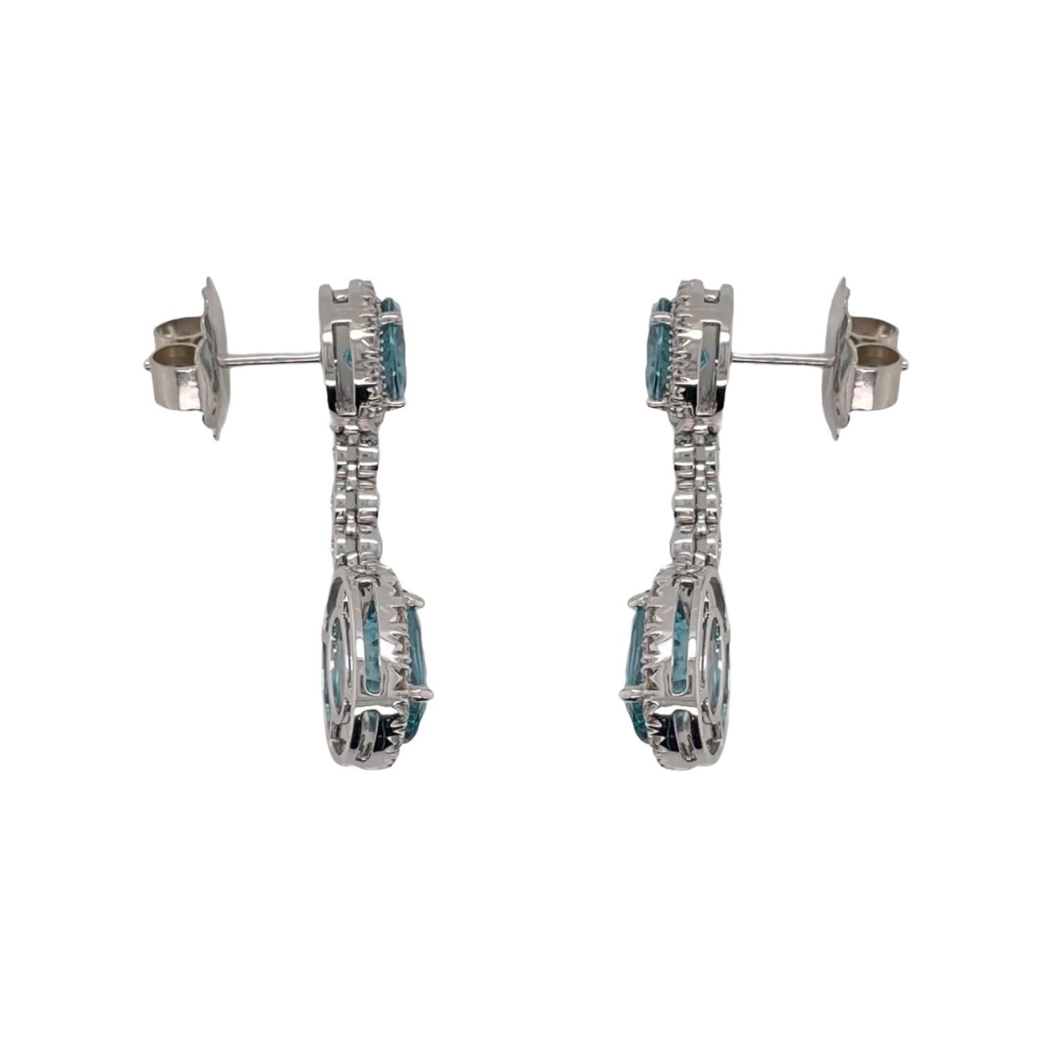 Oval Cut Blue Zircon & Diamond Drop Earrings in 18K White Gold For Sale