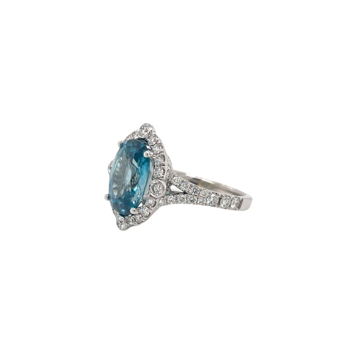 Contemporary Blue Zircon & Diamond Halo Ring in 18K White Gold