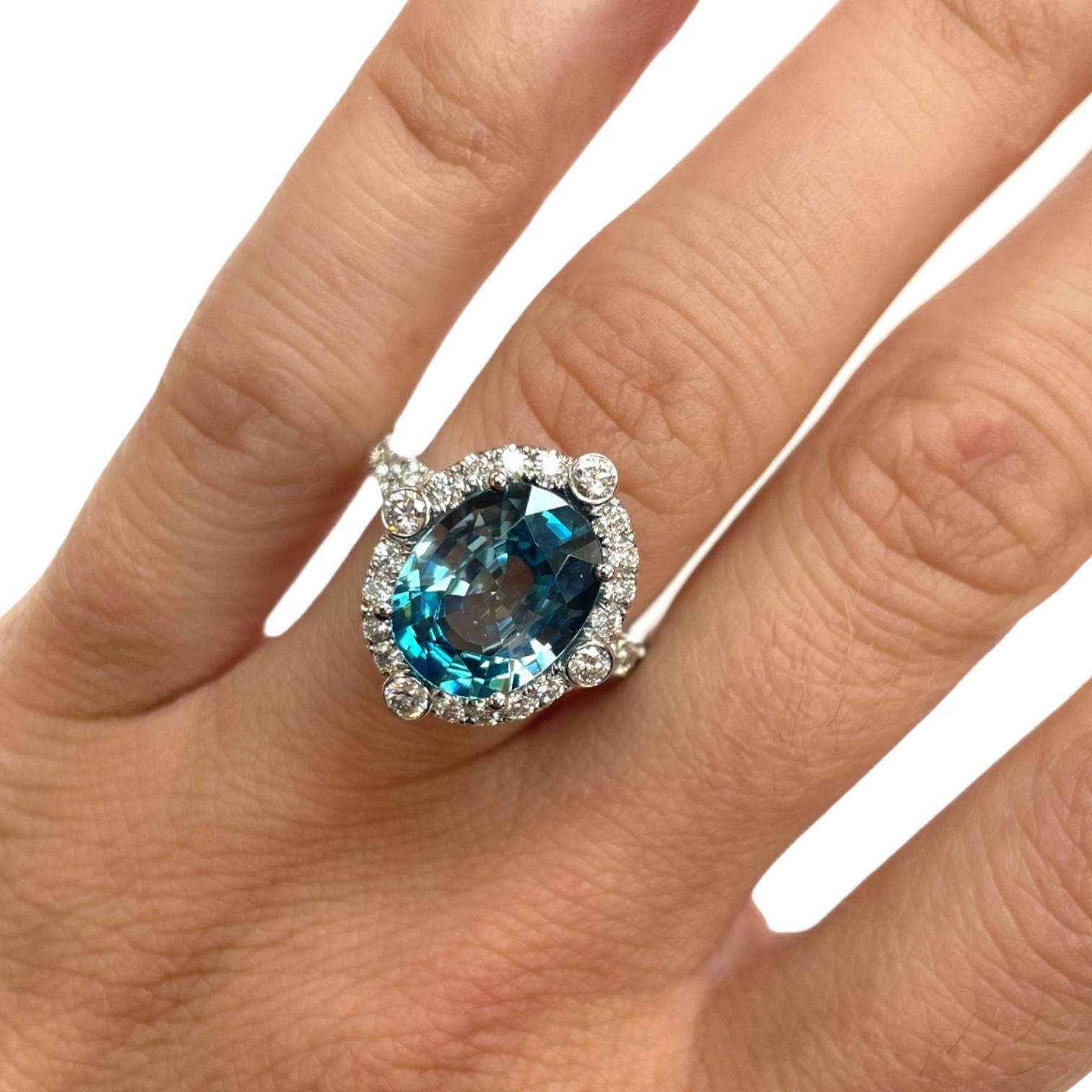 Oval Cut Blue Zircon & Diamond Halo Ring in 18K White Gold