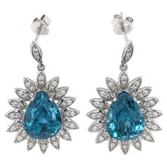 Orecchini a goccia con zircone blu e diamanti estratti dalla terra in oro bianco massiccio 14 carati