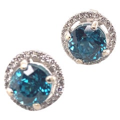 Borchie con zircone blu e diamanti in oro bianco 14 carati