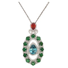 Pendentif en or blanc 14 carats avec zircon bleu, tsavorite, saphir orange et diamants