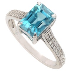 Blue Zirconia Ring With Pave Diamonds Made In 18k White Gold