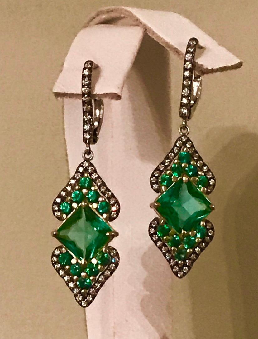 18 K White and Yellow Gold Earrings “Green Empress” Featuring Unique Squire Cut Blue/Green Tourmalines, Flanked by Tsavorite Garnets and Colorless Diamonds. One of a Kind, Made In USA, matching Ring is Available.
Blue/Green Tourmalines 3.52 CT’s