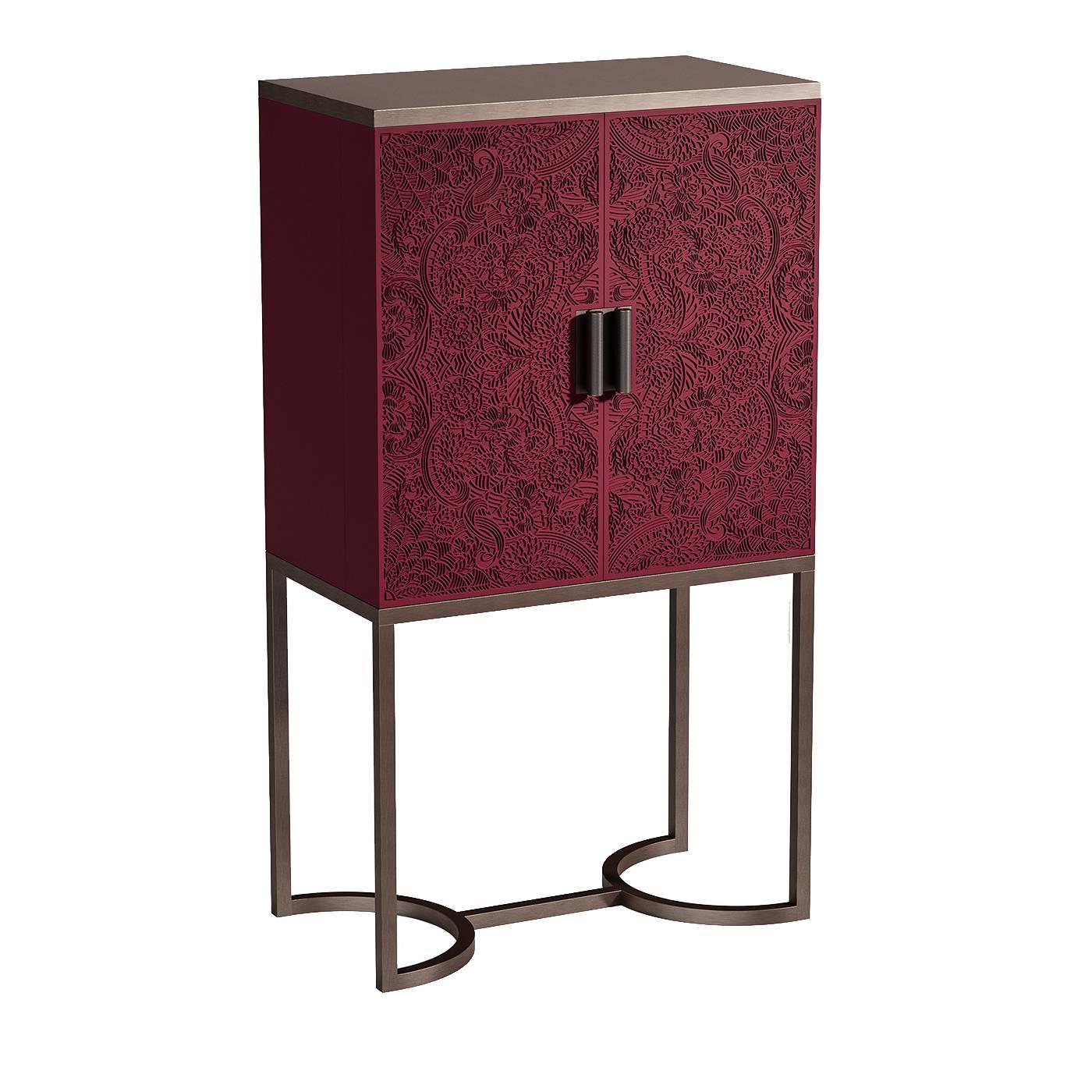 Part of the Bluemoon collection, this exquisite bar cabinet will elevate any dining room bar with its bold colors and modern lines. The square lacquered wood top features an eye-catching crimson color with paisley engravings and a velvet-like