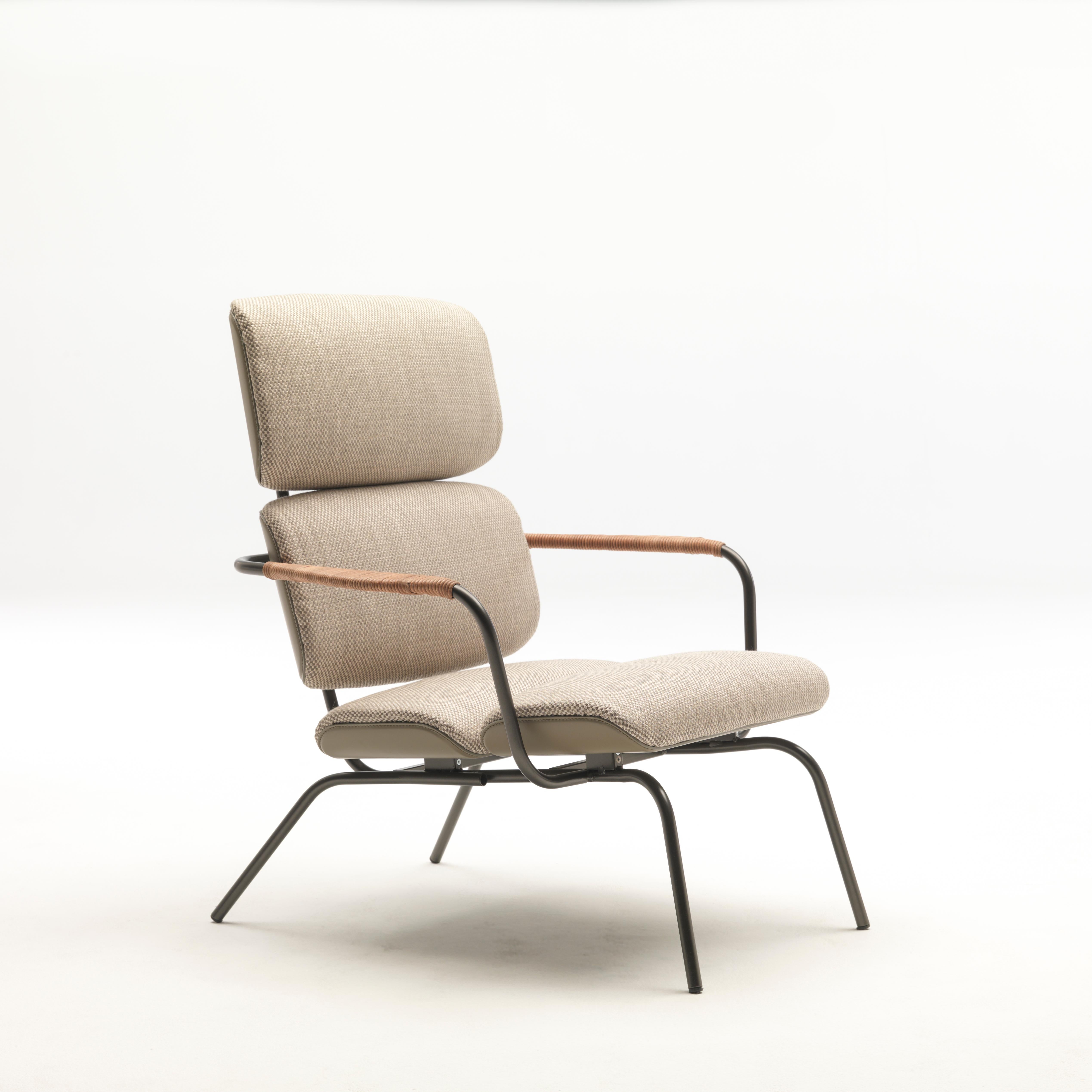 Bluemoon lounge chair by Patrick Jouin
Materials: BlueMoon armchair in bronze lacquered metal with seat and backrest in molded wood, upholstered in leather and fabric. Metal armrests are covered with braided natural leather thread. in fabric