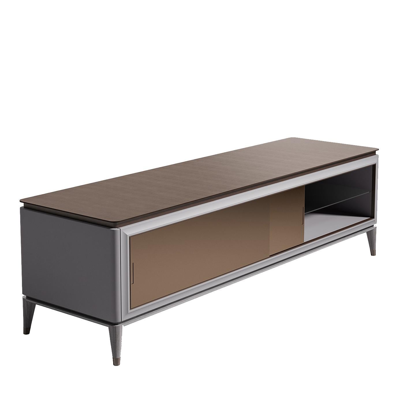 Reminiscent of Bauhaus furniture, the simple lines and bold forms of this polished cabinet will bring a sophisticated accent to a modern living room. The long and low rectangular cabinet is made of wood with a matte gray finish and has two sliding