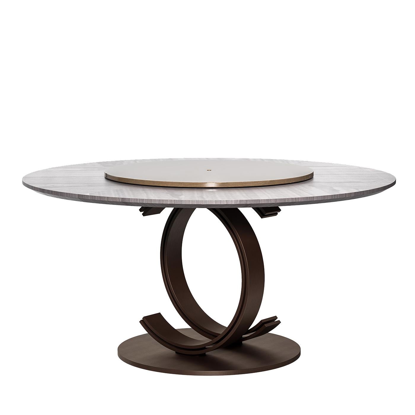 Part of the Bluemoon collection, this superb dining table is a functional piece of art for any dining room. Entirely made of inlaid veneer with a gray pattern of diagonal lines, the stately round top (180 cm diameter) is accented at the center with