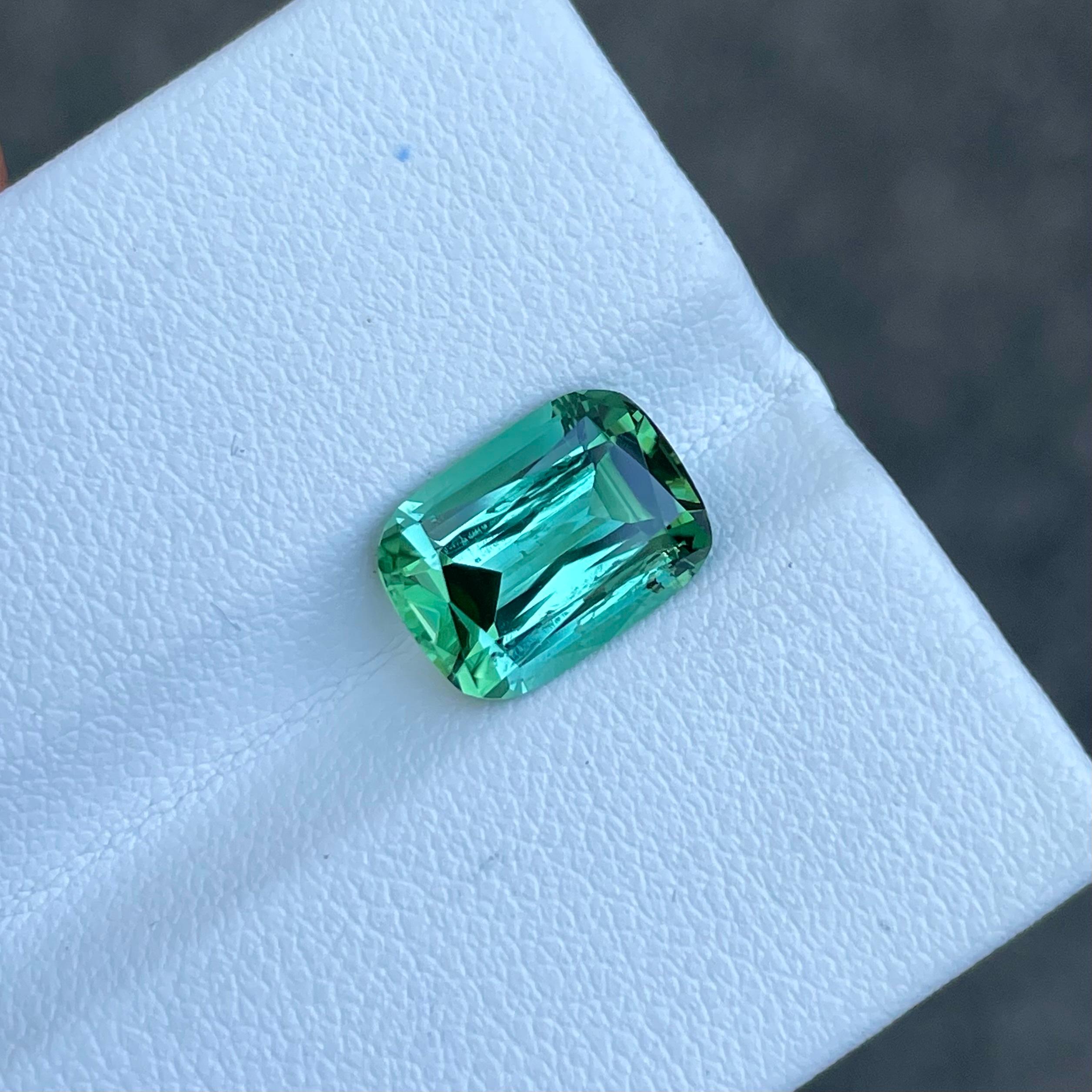 Weight 4.0 carats 
Dimensions 11.3x8.3x5.7 mm
Treatment None
Clarity VVS (Very, Very Slightly Included)
Origin Afghanistan
Shape Step Cushion
Cut Cushion




The Bluish Green Tourmaline, boasting a substantial weight of 4.00 carats, is a gemstone