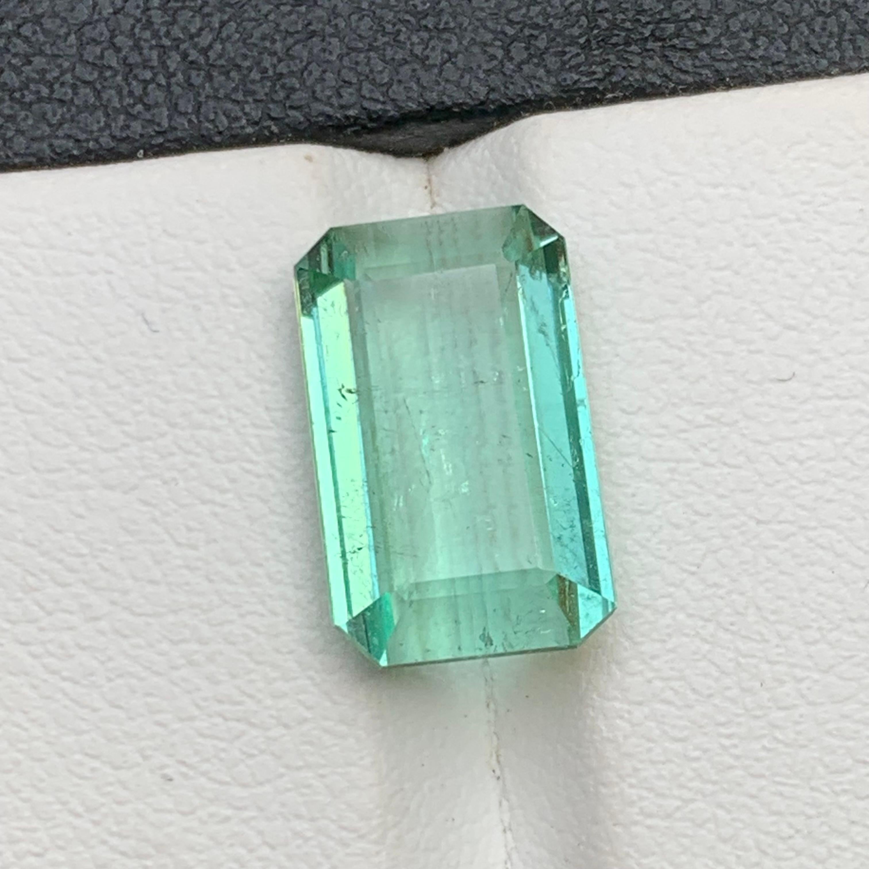 Bluish Neon Green Natural Tourmaline Loose Gemstone for Ring, Necklace Pendant or any other Jewelry Setting-Emerald Cut from Kunar, Afghanistan!!

💎 GEMSTONE TYPE: Tourmaline 
⚖️ WEIGHT:  6.95 Carat
🪚 SHAPE & CUT: Emerald Cut
📏 SIZE (MM): 14.15 x
