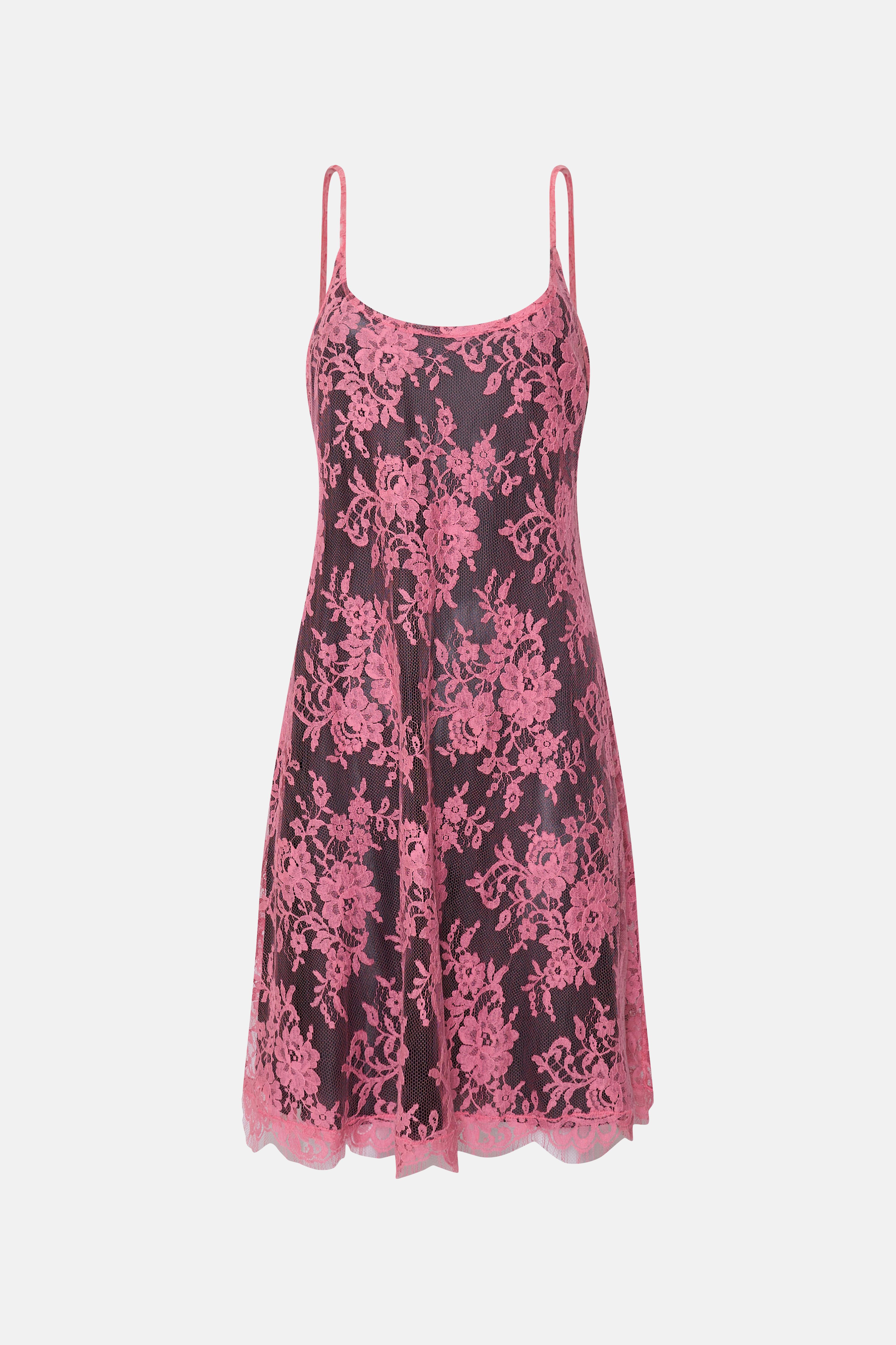 This Blumarine 90s pink lace slip dress is a stunning example of the era's romantic and feminine fashion. Crafted with a delicate lace overlay in a vibrant pink hue, the dress features a classic slip silhouette with thin spaghetti straps and a
