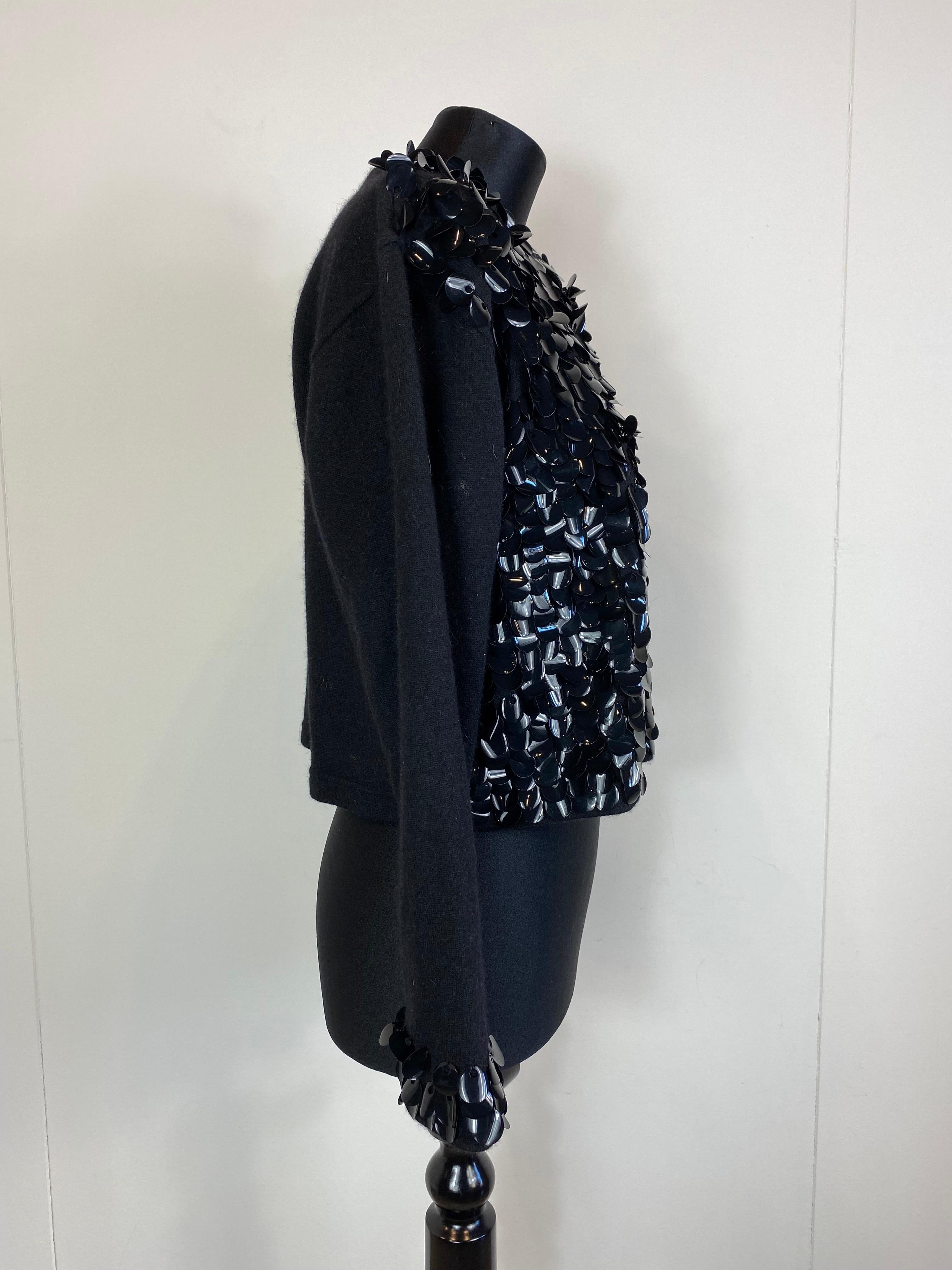 Blumarine black wool sweater. With sequins on the front and cuffs. 
Teardrop closure on the back. 
In very good condition. 
Size 46 
Shoulders 52 cm
Bust 58 cm
Waist 54 cm
Length 48 cm 
Sleeve Length 52 cm