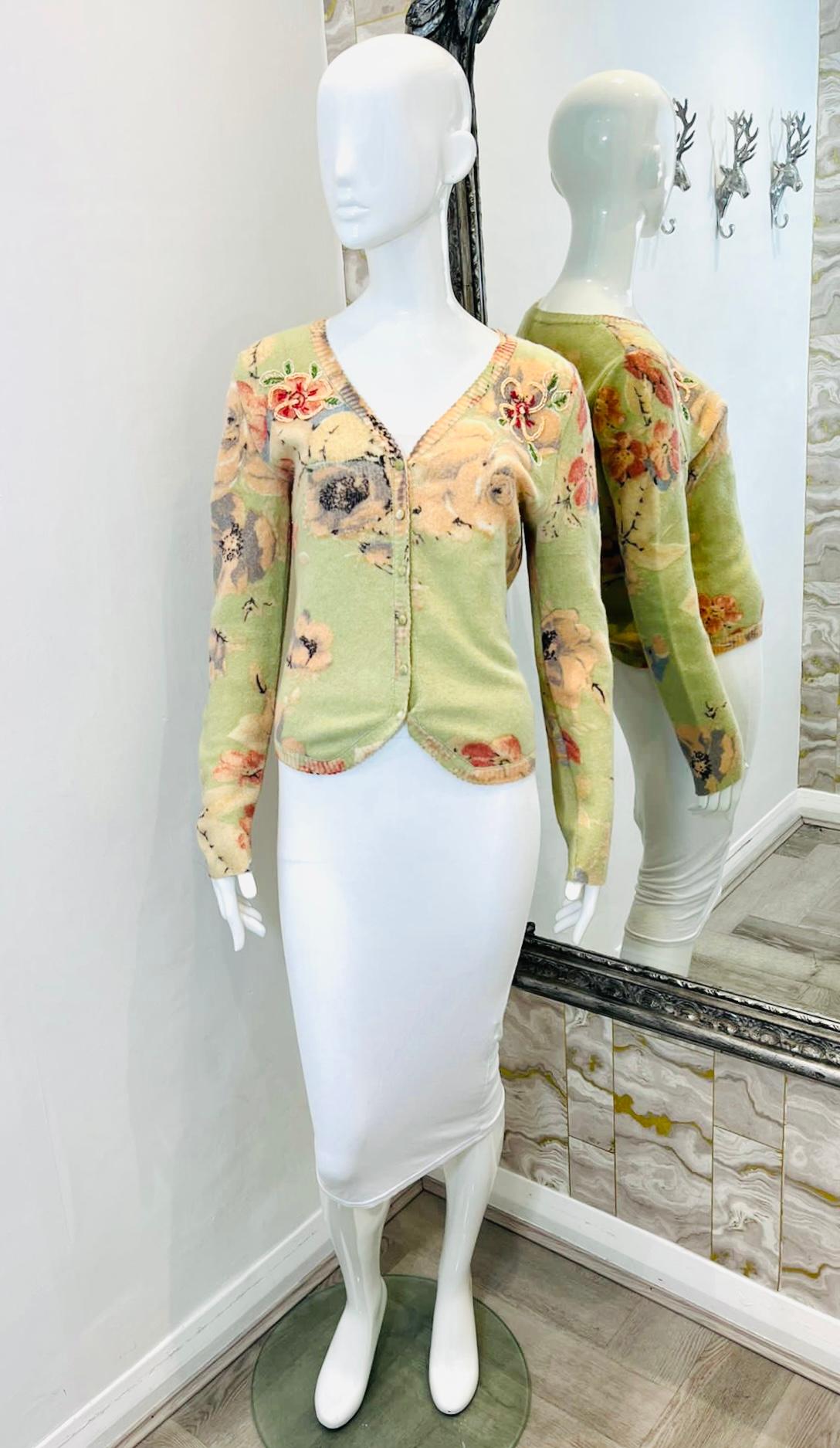 Blumarine Floral Embroidered Wool & Angora Cardigan

Pistachio green knitwear detailed with pastel floral designs and decorative bead embroidery to the sides.

Featuring V-Neckline and velvet button closure along the centre.

Size – S (Label missing