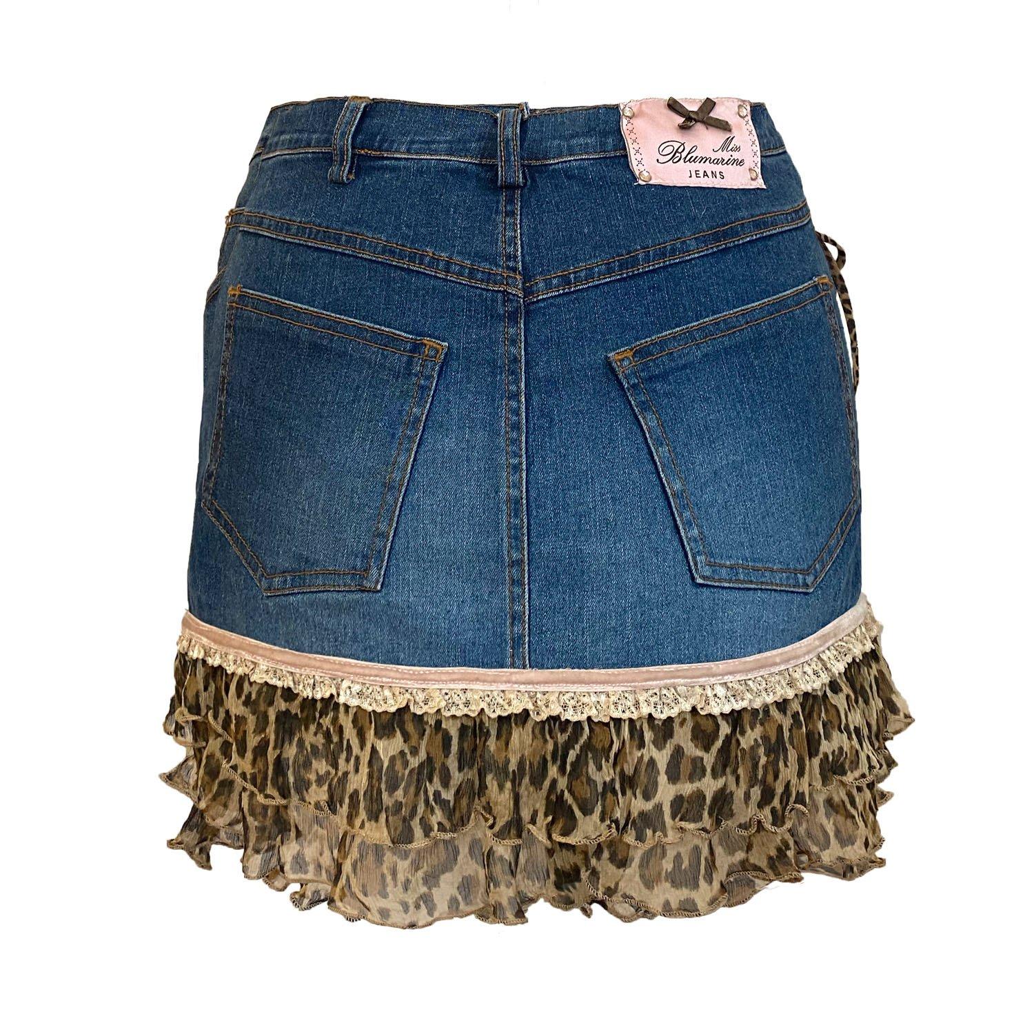 Vintage Blumarine Jeans blue denim mini skirt. Iconic 00s low-rise style, rare and hard to find. Tiered silk frill in a leopard print pattern with a lace and velvet banding. Miss Blumarine Jeans label in pink to the back featuring a bow and gems