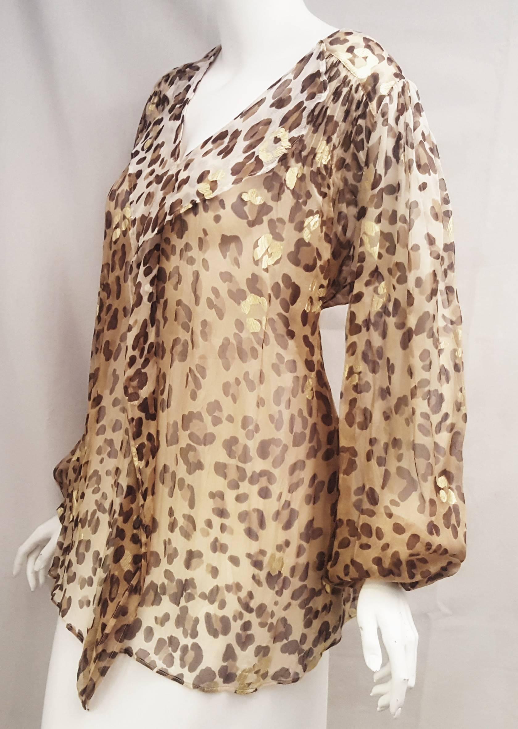 This Blumarine Leopard print silk top with ruffles at neckline and at front in transparent silk is easy to wear by the pool with a bathing suit or with a pair of jean.  It is loose fitting, not lined and in excellent condition.  The long sleeves