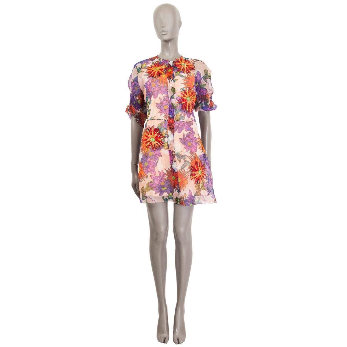 100% authentic Blumarine short-sleeve dress in muticolor floral printed sheer silk (100% Missing Tag). Opens with eight hidden buttons at front and comes with a apricot colored silk slip dress underneath. Embellished with four red and orange sequin