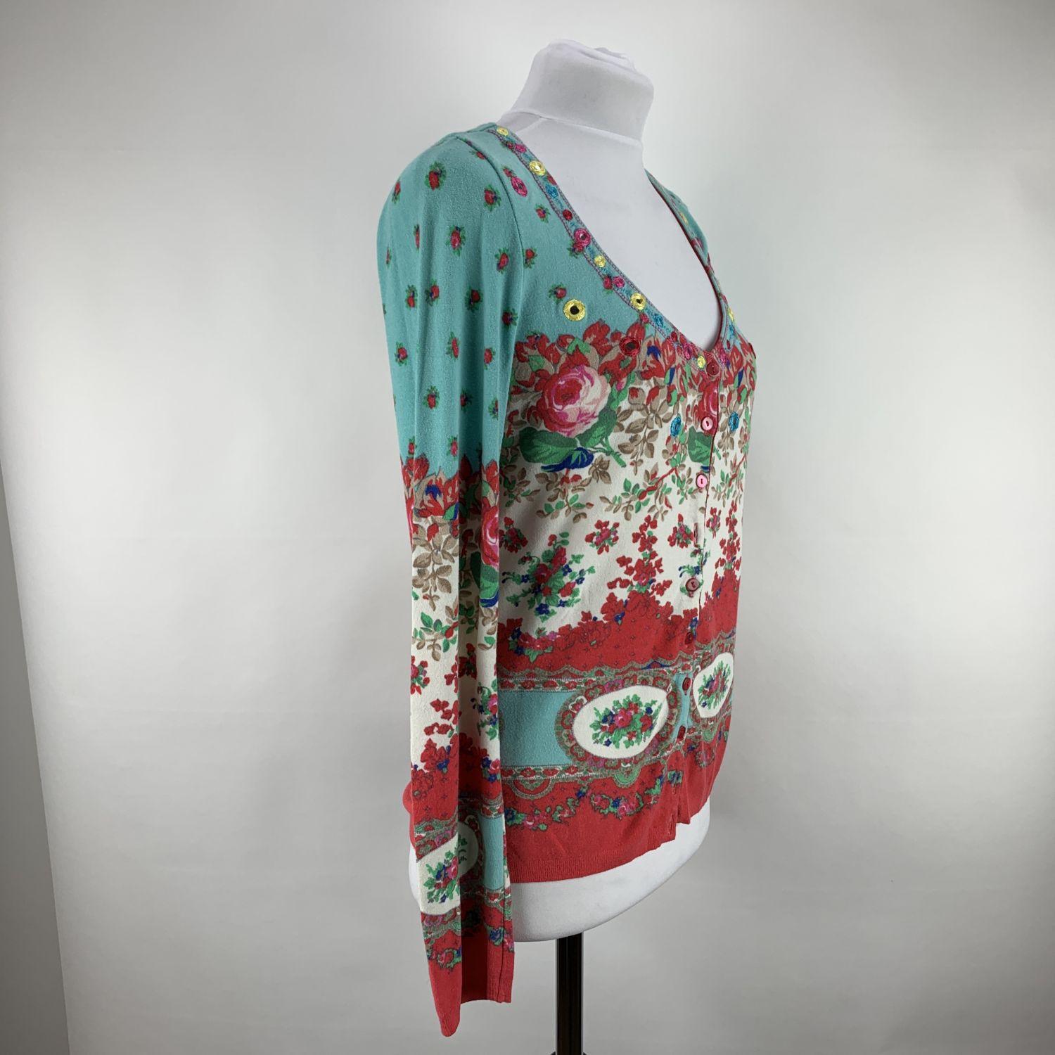 Blumarine multicolored floral cardigan. Small mirror embellishment. Button closure on the front. Composition: 95% Rayon, 5% Spandex. Size: 44 IT, 38 D (The size shown for this item is the size indicated by the designer on the label). It should