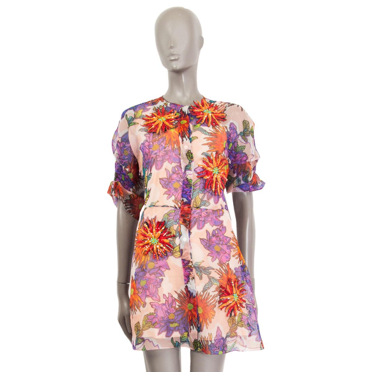 100% authentic Blumarine short-sleeve dress in muticolor floral printed sheer silk (100% Missing Tag). Opens with eight hidden buttons at front and comes with an apricot colored silk slip dress underneath. Embellished with four red and orange sequin