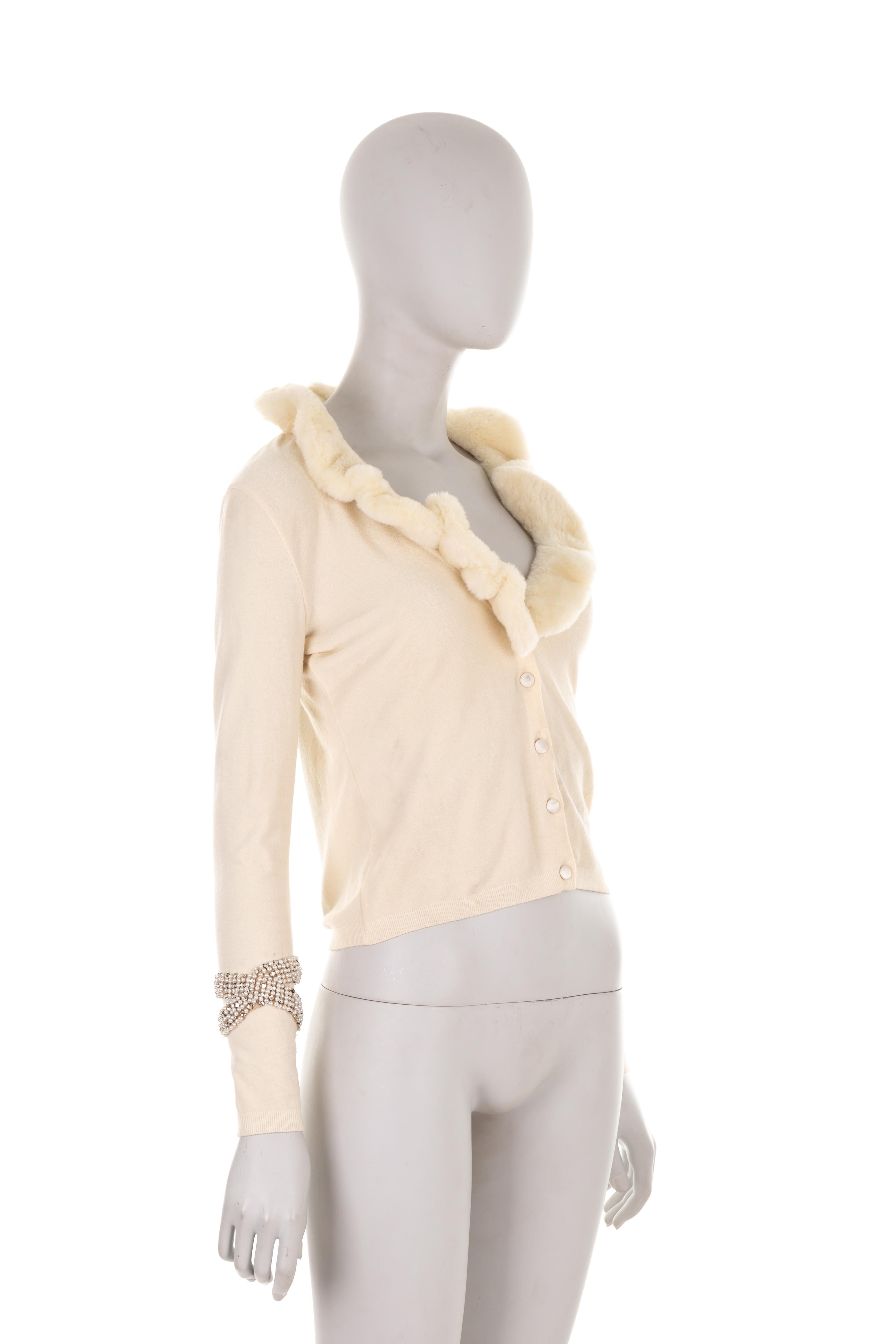 - Blumarine by Anna Molinari
- Sold by Gold Palms Vintage
- Spring summer 2007 collection
- Off-white wool crop cardigan
- Long sleeve
- Rabbit fur collar
- Swarovski and pearl sleeve embroidery
- No size label (fits S)

Shoulder to shoulder: 39 cm/