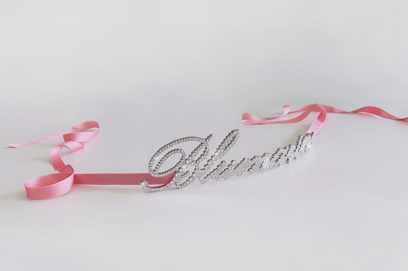 

Gorgeous statement piece! BLUMARINE Logo embellished belt featuring rhinestone crystal embellishment and rear pink satin ribbon fastening.
Rhinestonelogo measures ca.30,5cm x ca.6,5cm


please note that any pictures of documentation like runway