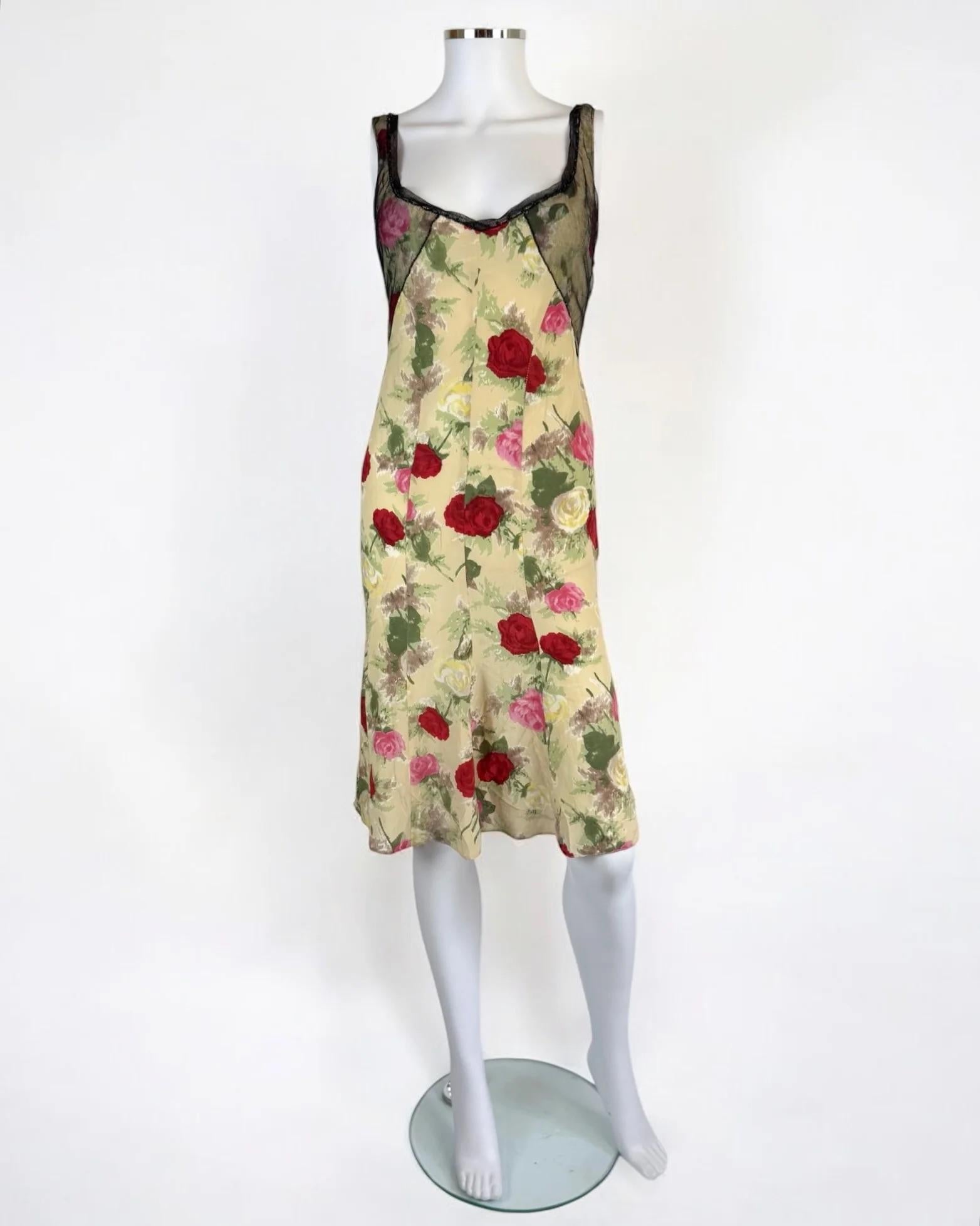 Blumarine by Anna Molinari silk floral dress, Spring Summer 1999
This dress featured on the runway twice, and the vivid rose print featured throughout various pieces
Sheer black mesh trim around neckline and bodice both at back and front, adorned