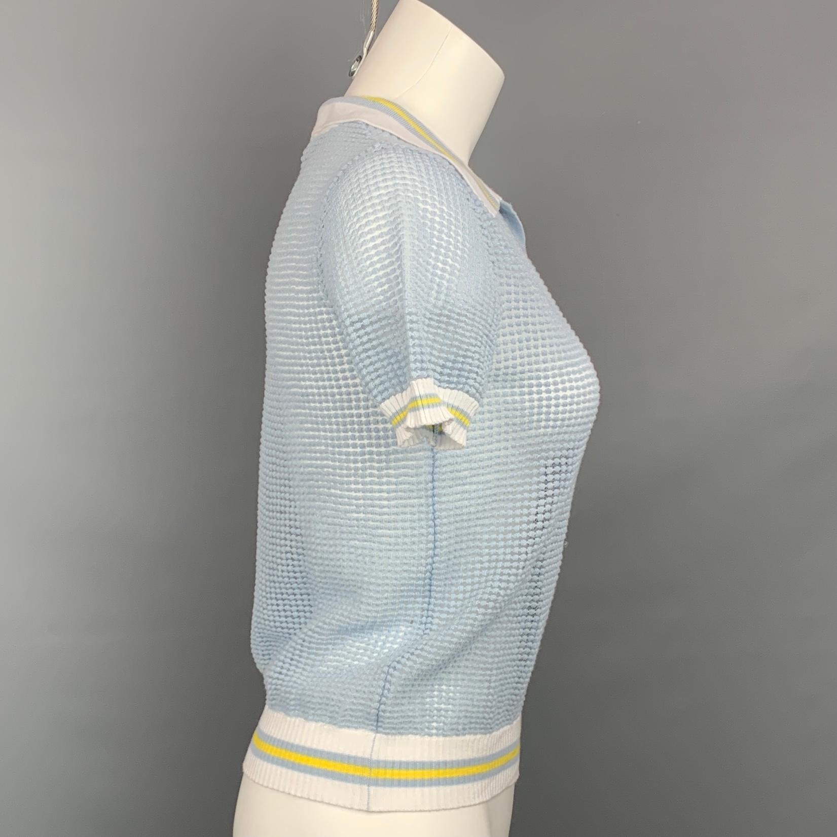BLUMARINE polo shirt comes in a light blue & white textured material featuring a ribbed hem, spread collar, and open front. 

Very Good Pre-Owned Condition.
Marked: I 38 / D 32

Measurements:

Shoulder: 13 in.
Bust: 34 in.
Sleeve: 9 in.
Length: 20.5