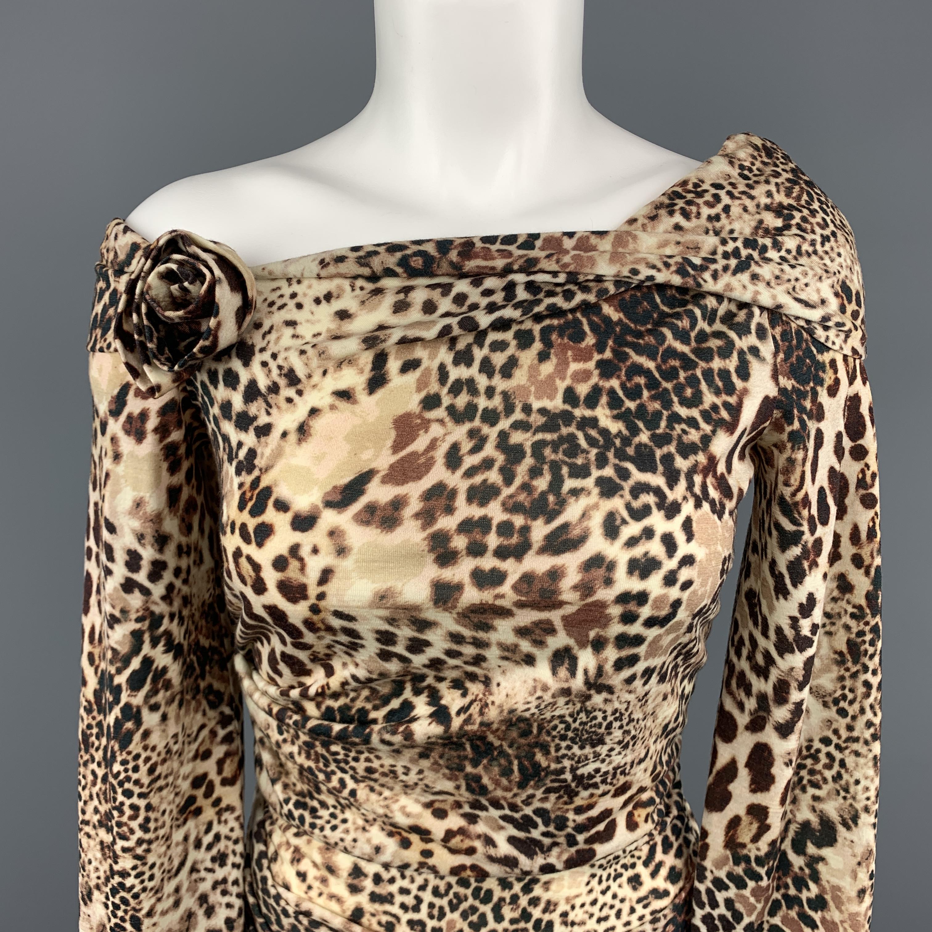 BLUMARINE top comes in beige leopard print wool jersey knit with a ruched body, long sleeves, and asymmetrical off the shoulder cuff neckline with rosette. Made in Italy.
 
Excellent Pre-Owned Condition.
Marked: 4
 
Measurements:
 
Shoulder:17
