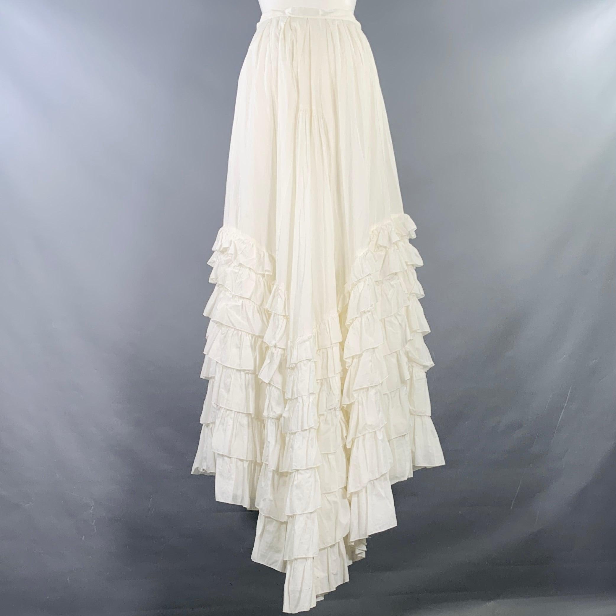 BLUMARINE skirt
in a white cotton woven fabric featuring a tiered ruffle design, longer back, and side zipper closure. Made in Italy.Excellent Pre-Owned Condition. 

Marked:   IT 40 

Measurements: 
  Waist: 27 inches Hip: 36 inches Length: 50.5