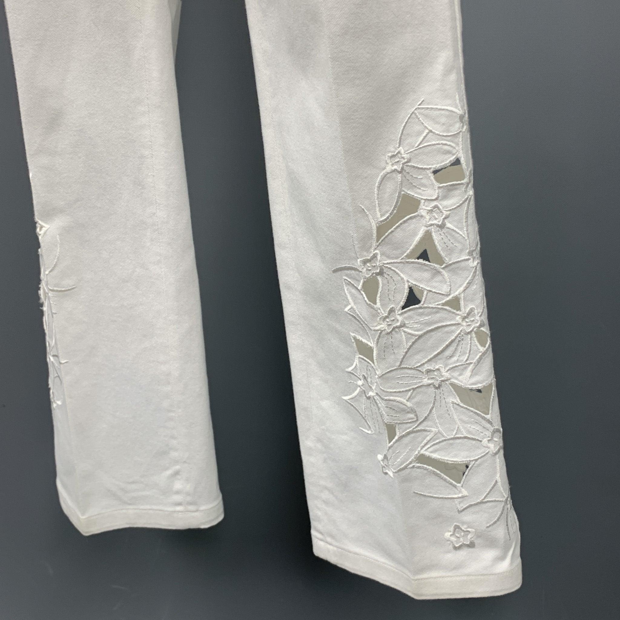 BLUMARINE jeans comes in a white denim featuring a embroidered cut out design, straight leg, and a zip fly closure.
 Very Good
 Pre-Owned Condition. 
 

 Marked:  40 
 

 Measurements: 
  Waist: 30 inches 
 Rise: 7 inches 
 Inseam: 30 inches 
  
  
