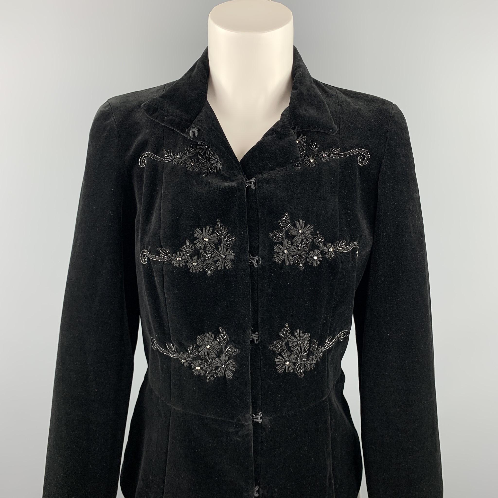 BLUMARINE jacket comes in a black cotton velvet with a full black liner featuring embroidered details, spread collar, and a hook & eye closure. Made in Italy.

Very Good Pre-Owned Condition.
Marked: IT 42 / D 36

Measurements:

Shoulder: 15