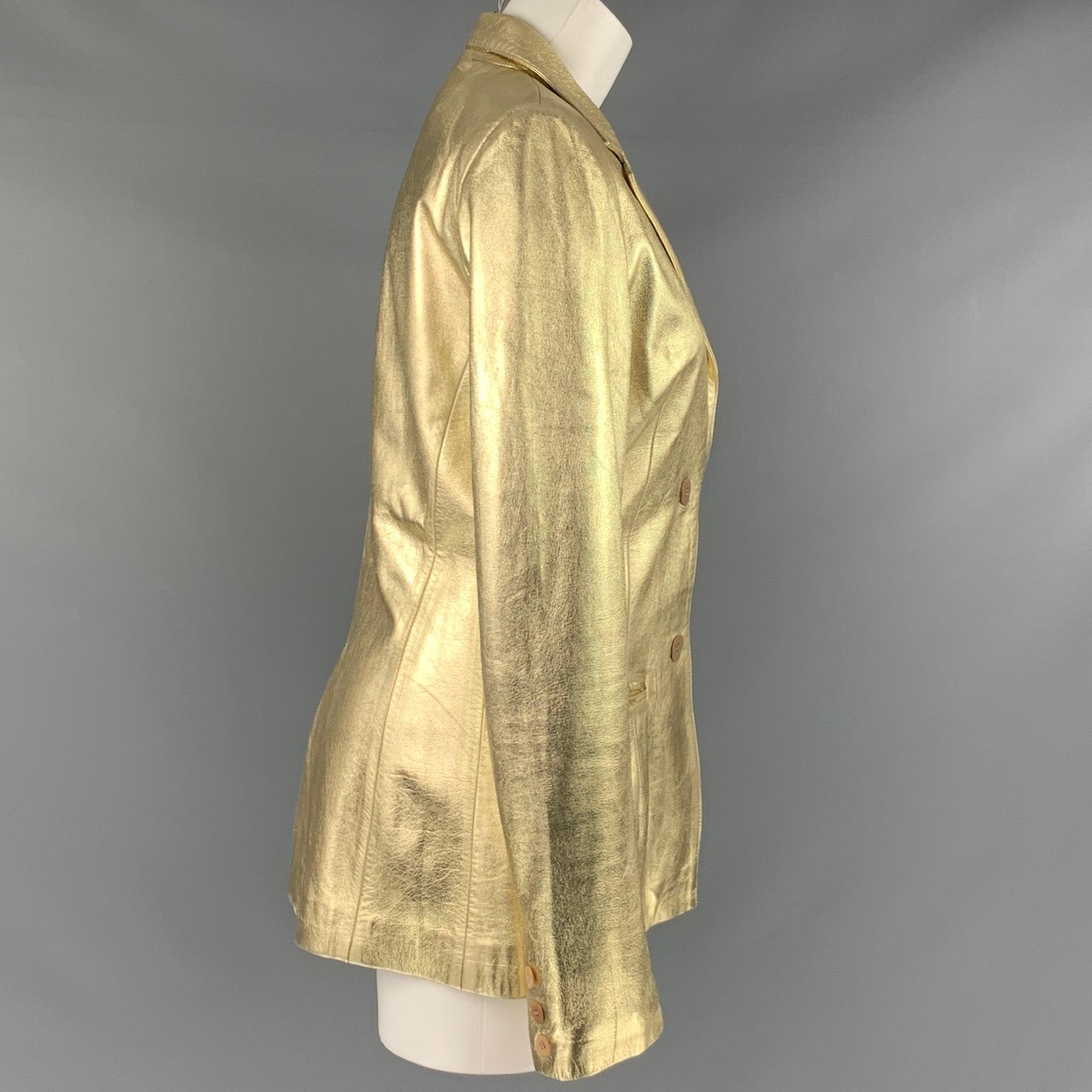 BLUMARINE jacket in a metallic gold lambskin leather fabric featuring notch lapel, two pockets, and a two button closure. Made in Italy.Very Good Pre-Owned Condition. Moderate signs of wear. 

Marked:   IT 44 

Measurements: 
 
Shoulder: 16 inches