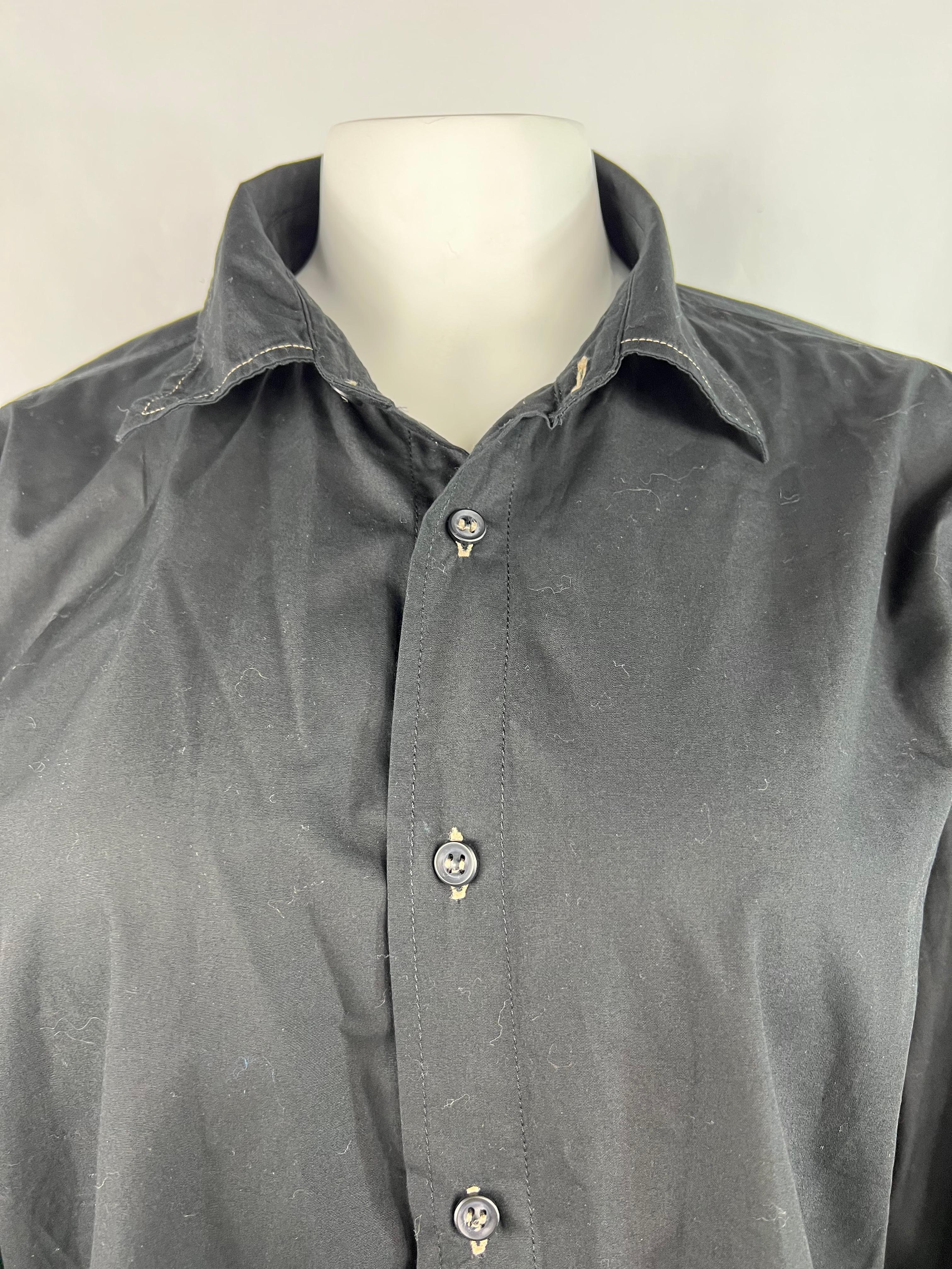 Product details:

The shirt features collar, front button down closure. Made in Italy.