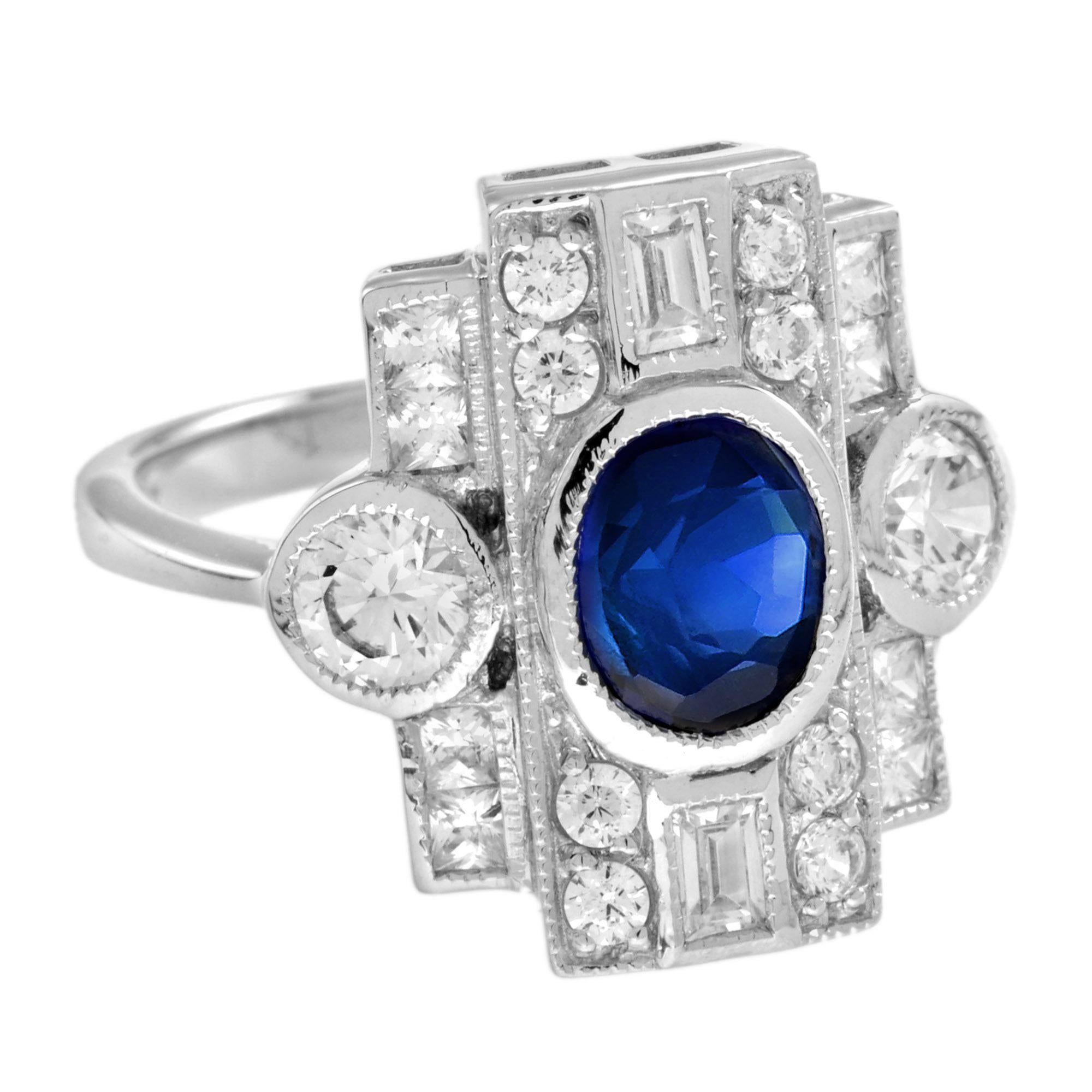 This stunning ring displays the outstanding workmanship famous inspired by Art Deco era.
Centered on a 1.6 carat natural oval Ceylon sapphire, with a 3.9 mm. round diamond to each side and diamond geometric frame. 18K White Gold. 
Ring