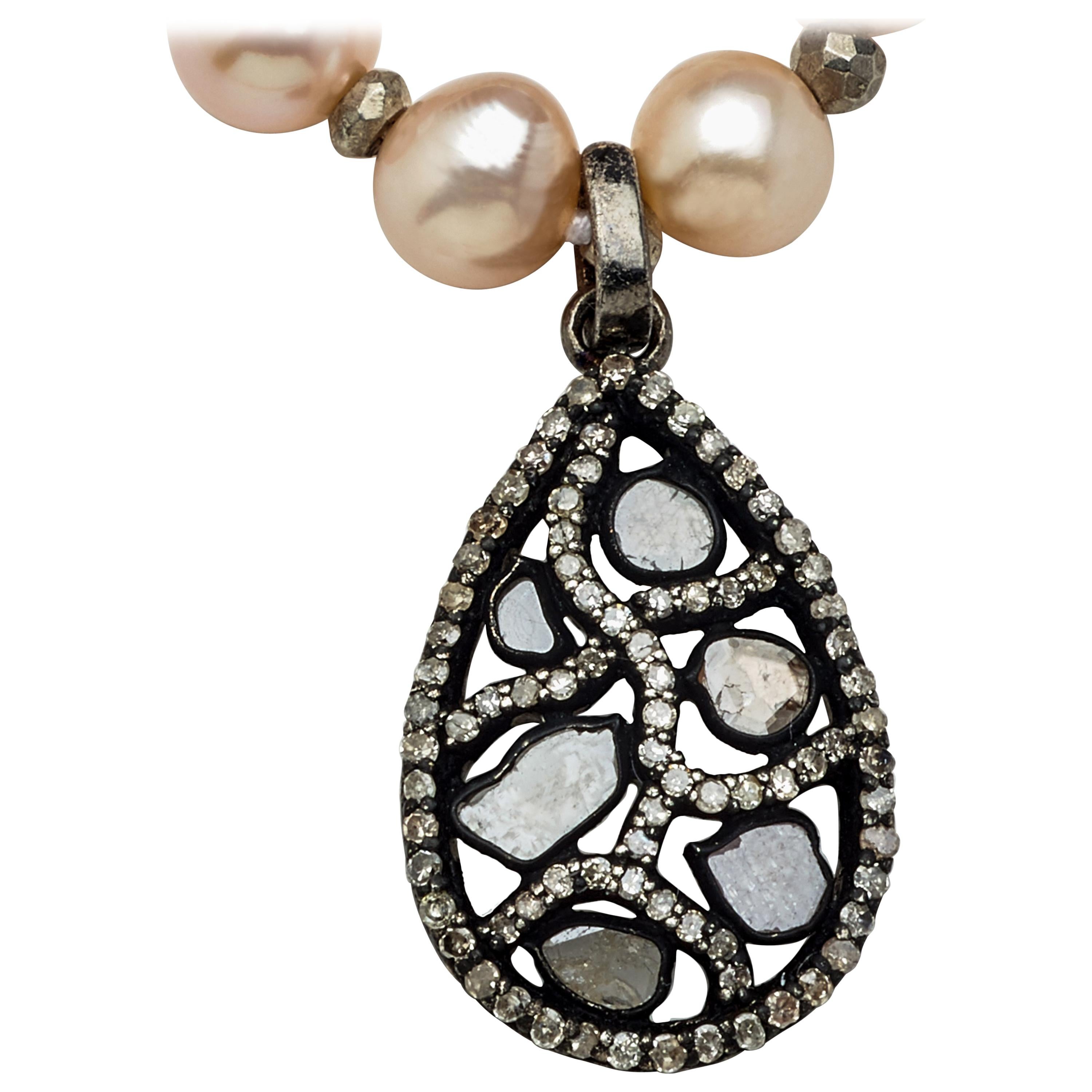Pretty in Pink, this blush pearl 28 inch strand of eighty-eight 6-1/4mm genuine fine Akoya pearls are hand-strung with enhancing 
Genuine silver pyrite beads leading to a stunning and unique stained glass-like diamond and sterling silver teardrop