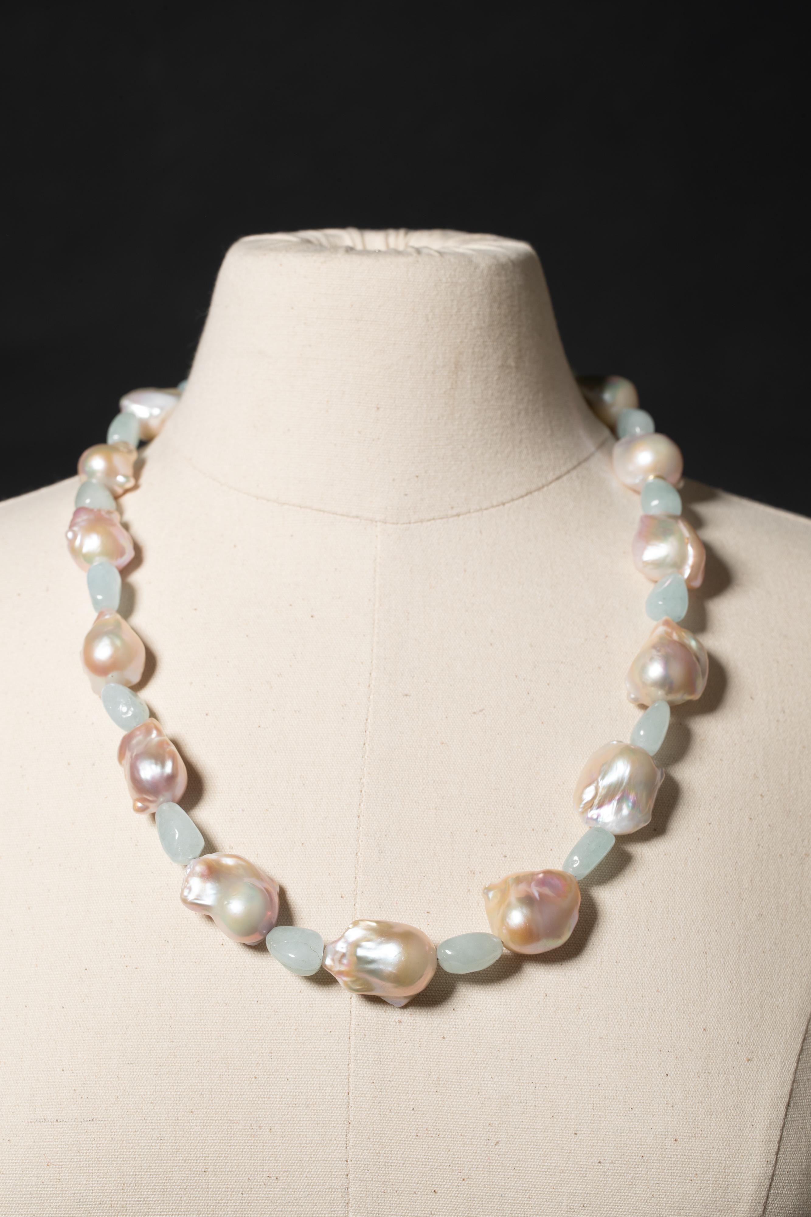 A versatile necklace of rare blush baroque pearls with tumbled aquamarines between.  This can be worn long or short as there is a jump ring quietly placed to clasp it at 19