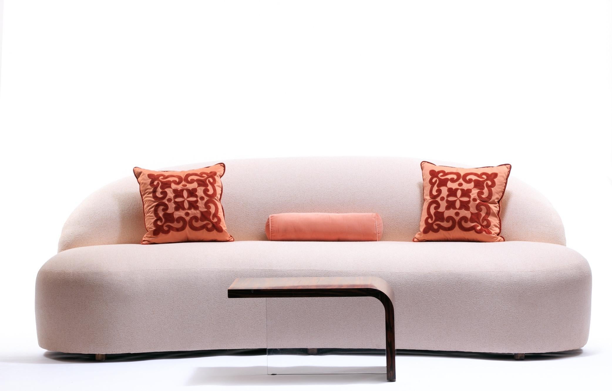 One look at this sofa, and you're hooked. The perfect pink blush-tone bouclé fabric and the soft, inviting curves are so seductive. It evokes a warm, loving feeling that is soothing, welcoming and inviting - like a blush rose. You can't help but to