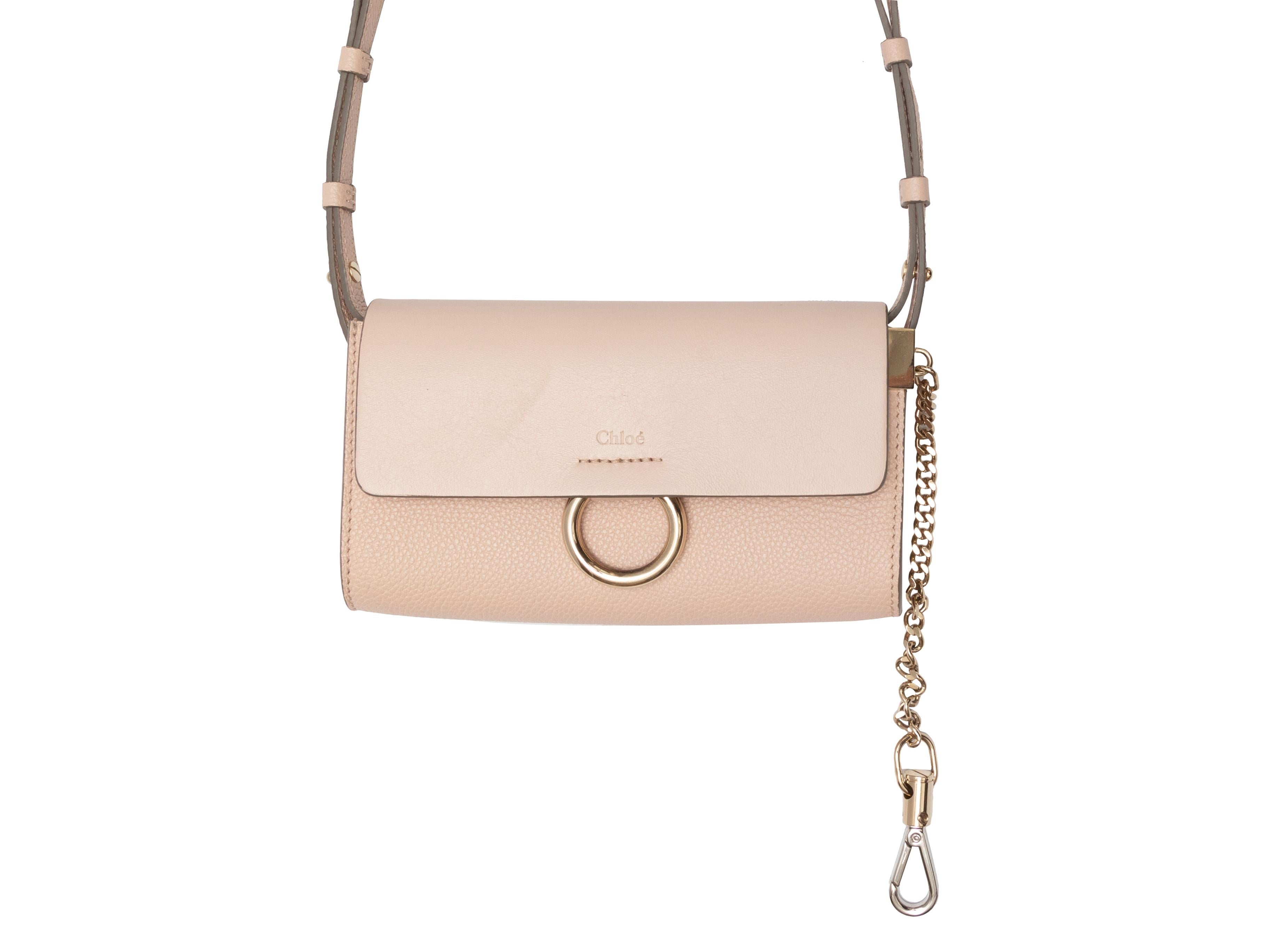 Blush Chloe Small Leather Crossbody Bag. This crossbody bag features a leather body, gold-tone hardware, multiple interior card and cash slots, single flat adjustable crossbody strap, and a top flap closure. 7