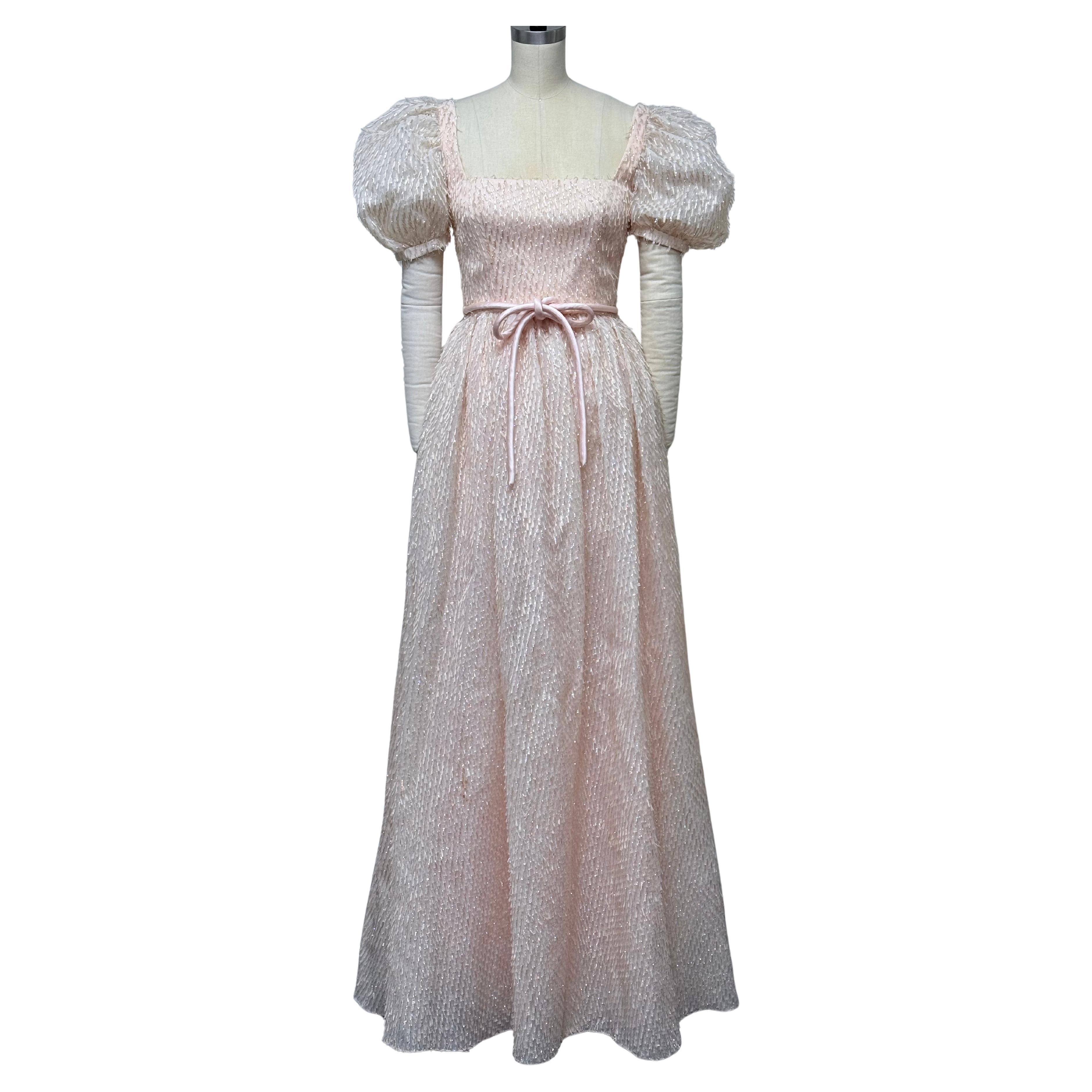Blush Eyelash Brocade Puff Sleeve Gown with Gathered Skirt and Satin Corded Belt For Sale