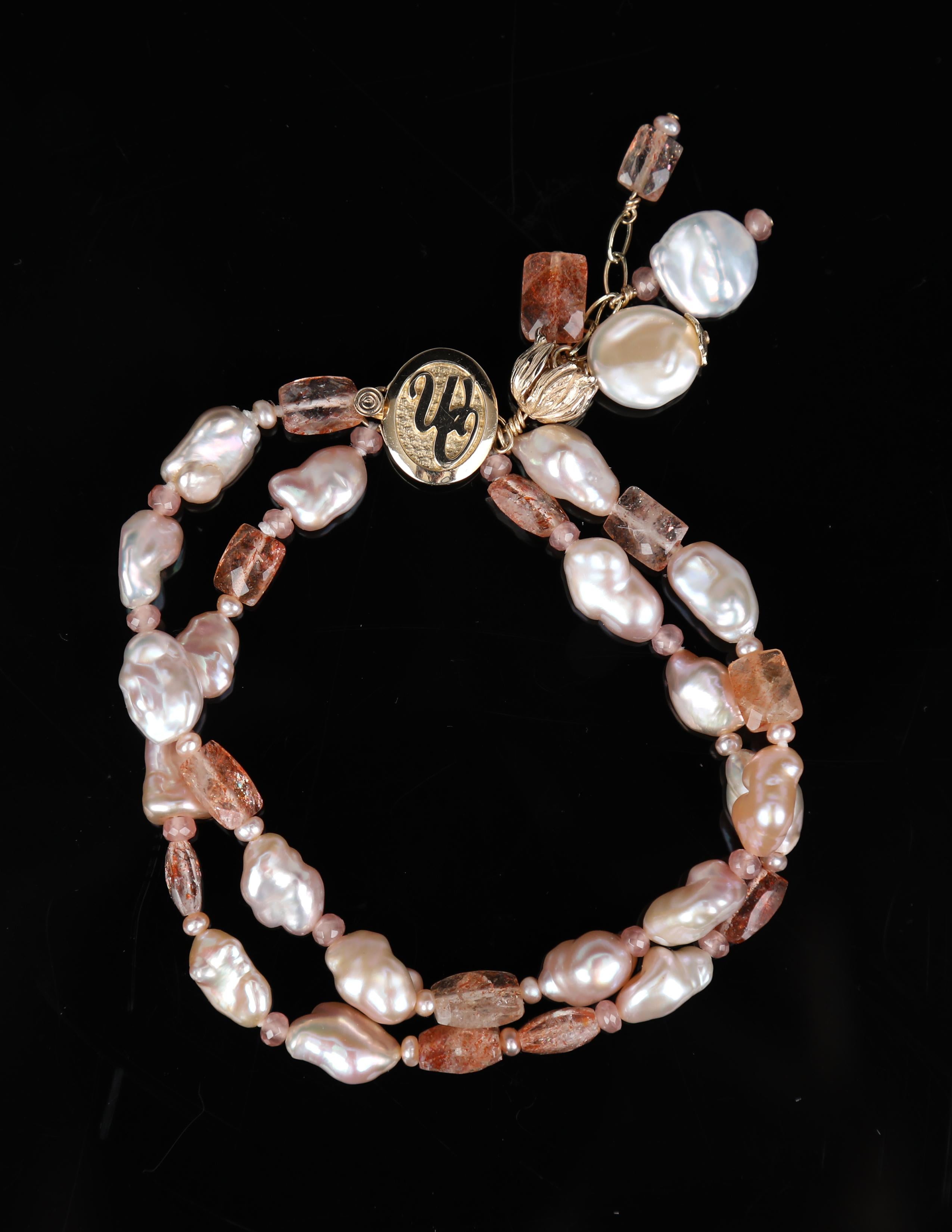 A pearl, rhodochrosite, sunstone, and gold bracelet encourages expressions of joy.  